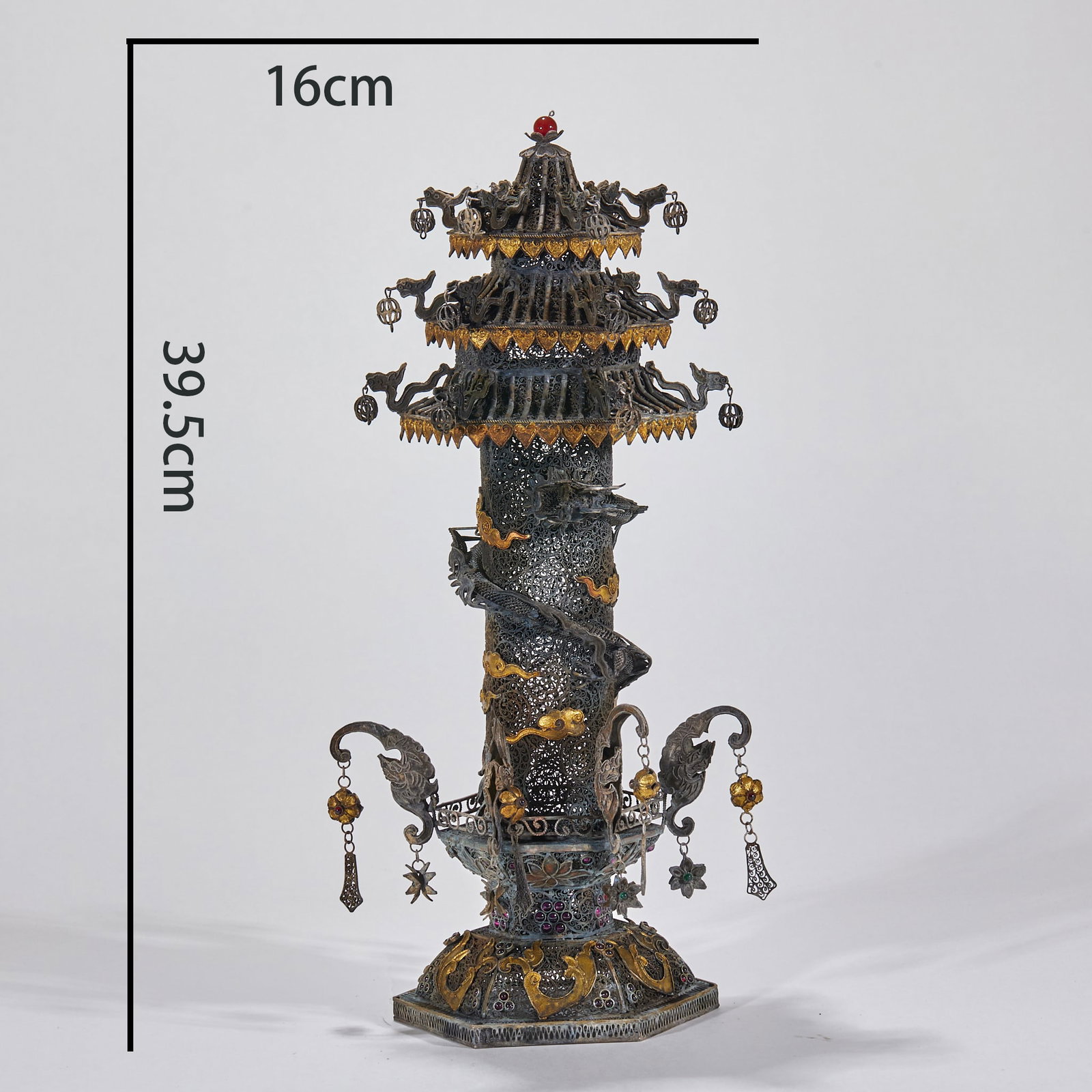 Filigree Coiled-Dragon Pagoda: A filigree pagoda with a coiled dragon on the body, fine filigree, partly gilded. A Qing filigree-inlaid craft, translucent and exquisite. H 39.5 cm, Diameter 16 cm, 1087 g.