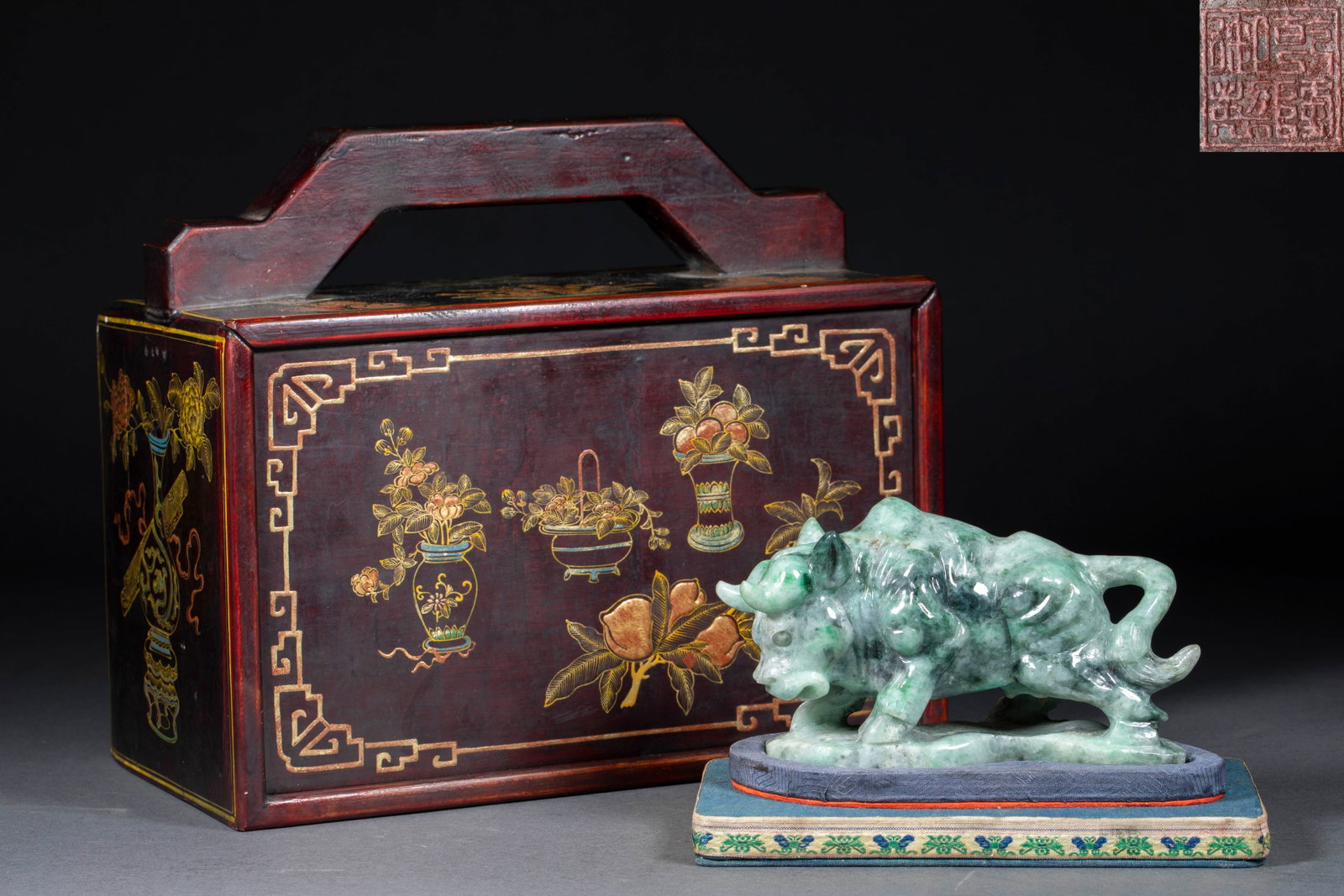 Qing Guangxu Liu Tongxun 'Niu Qi Chong Tian' Ornament: A Qing Guangxu stone or jade carving of an ox with raised head, in a surging posture, on a wood base. Associated with Liu Tongxun, symbolising high-spirited vigour ?? a display ornament. H 8 cm, L 15