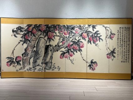 Wu Changshuo Peach-of-Longevity Screen: A screen painted with a longevity peach, large and full, symbolising long life. Freehand ink with bright colour ?? a flower-and-bird painting by the modern painter Wu Changshuo. L 360 cm, W 138 cm.