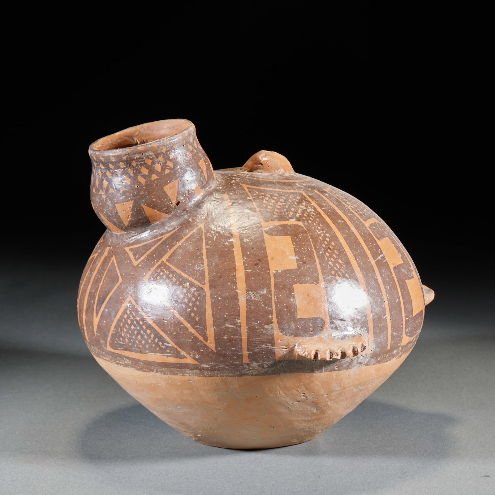 Majiayao Culture Bird-Form Painted Jar: A Majiayao culture bird-form painted jar of fine red earthenware, modelled as a bird, the body painted in black with geometric patterns. Lively form ?? a fine primitive painted pottery of prehistoric