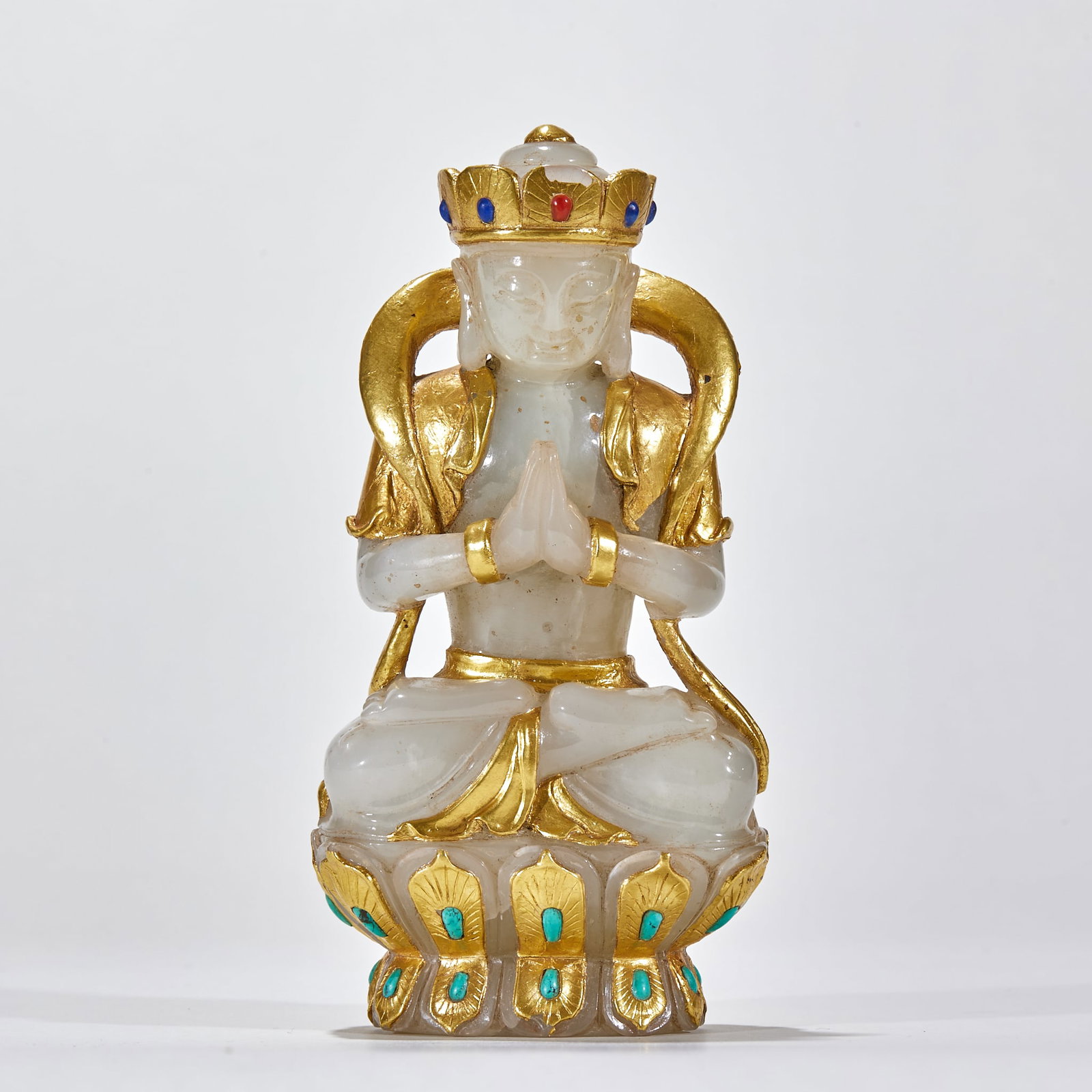 Hetian Jade Pure-Gold-Wrapped Buddha Image: A Hetian jade Buddha image with parts wrapped in pure gold. Warm jade and bright gold; the Buddha is solemn ?? an offering and display vessel. H 14.5 cm, L 7.5 cm, W 4.5 cm, 563 g.