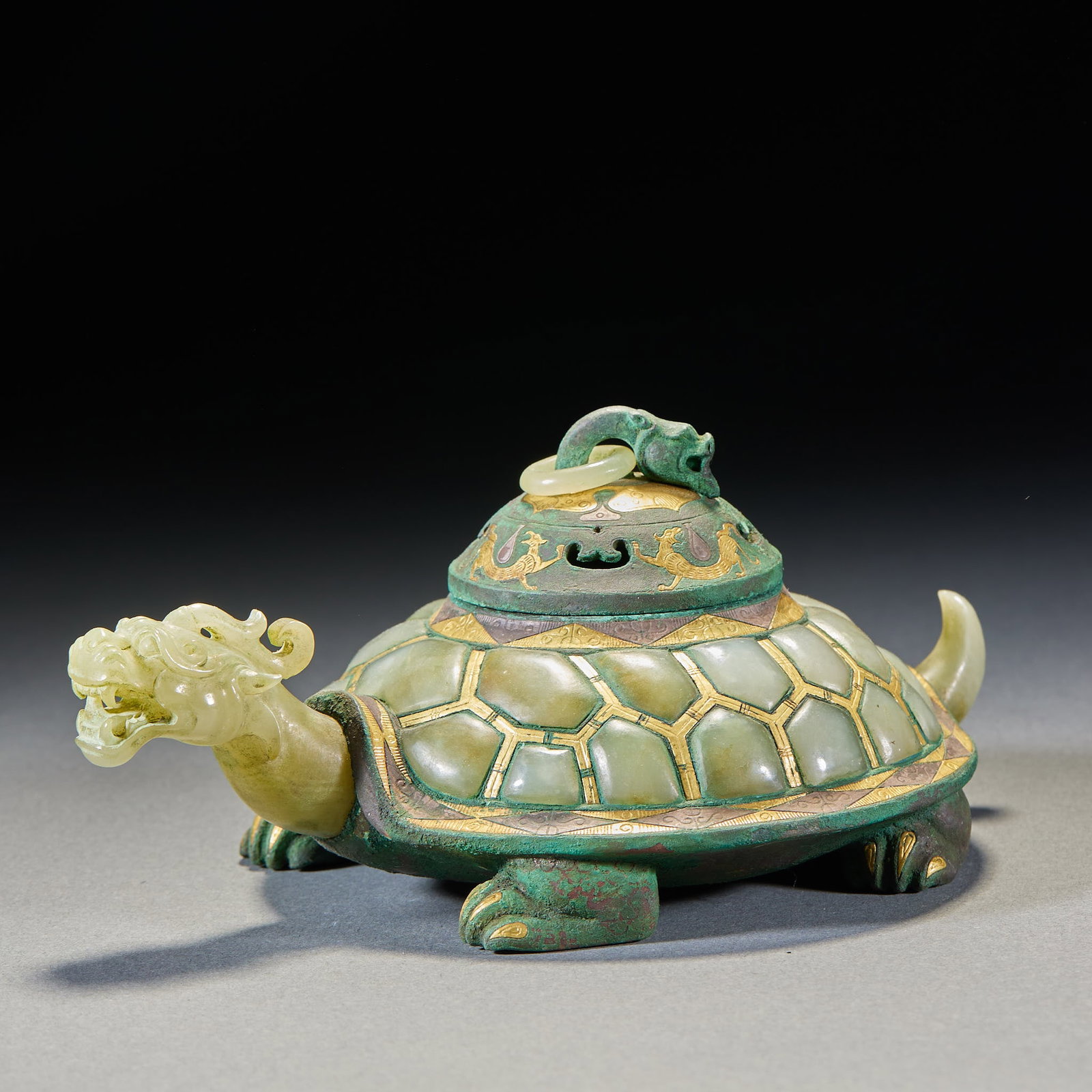 Pre-Ming Inlaid-Gold-and-Silver Jade Incense Burner: A pre-Ming jade incense burner on a jade body, inlaid with gold and silver, gold and silver shining. In censer or box form for burning incense. Warm jade with fine craft ?? an archaic inlaid