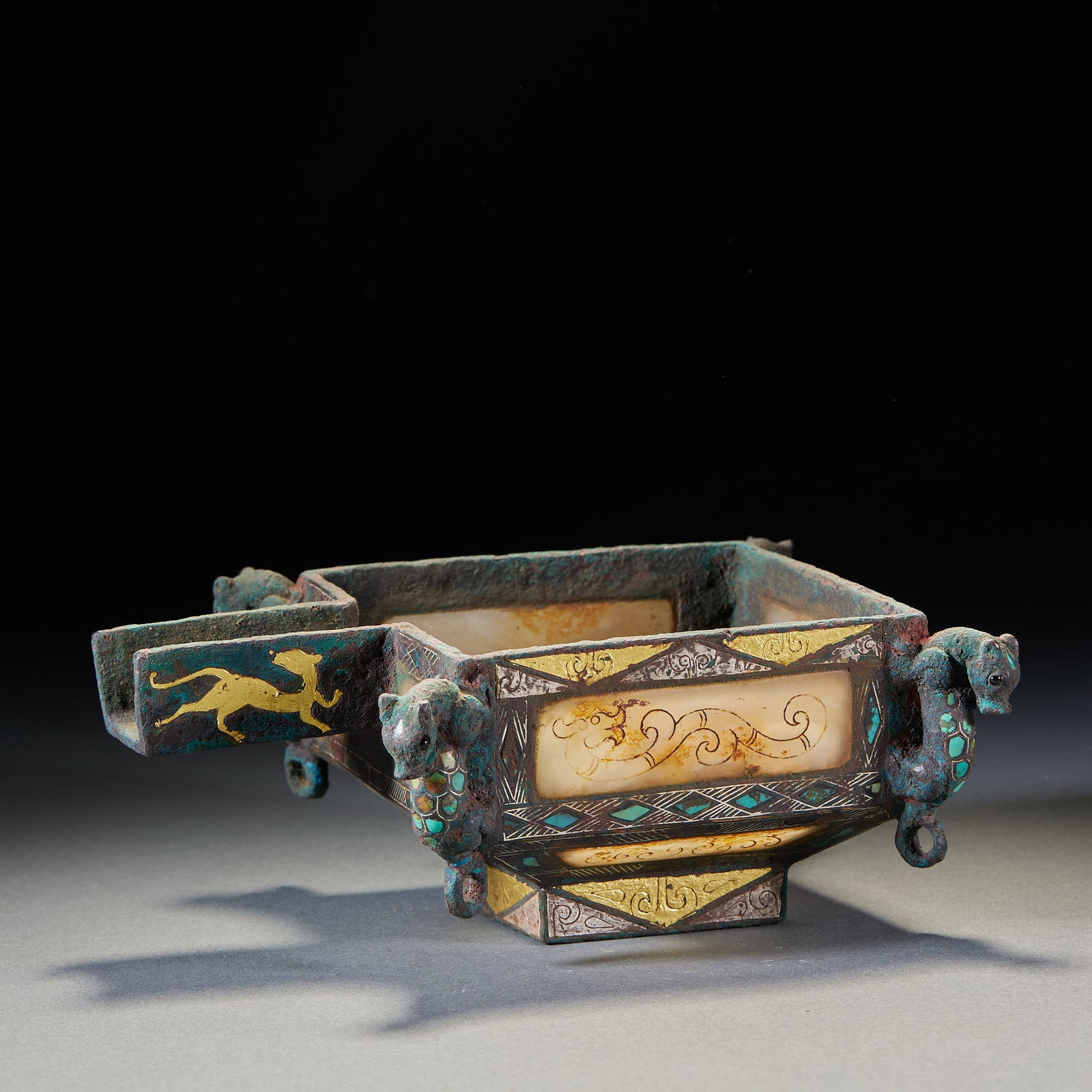 Pre-Ming Inlaid-Gold-and-Silver Auspicious-Beast Vessel: A pre-Ming bronze vessel inlaid with gold and silver in auspicious-beast motifs, fierce beasts, bright gold-silver decoration. An archaic inlaid bronze, both practical and display. H 7.5 cm, L 18 cm,