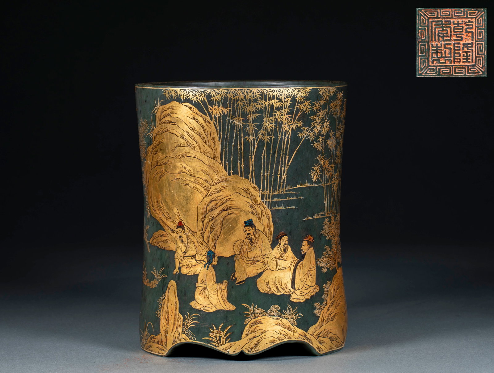 Qianlong Spinach-Jade Gold-Foil 'Seven Worthies of the Bamboo Grove' Brush Pot: A Qianlong spinach-jade brush pot with the exterior carved with the Seven Worthies of the Bamboo Grove and gilded, literati gathering. Warm jade and bright gold-foil ?? a major scholar's piece. H 20 c