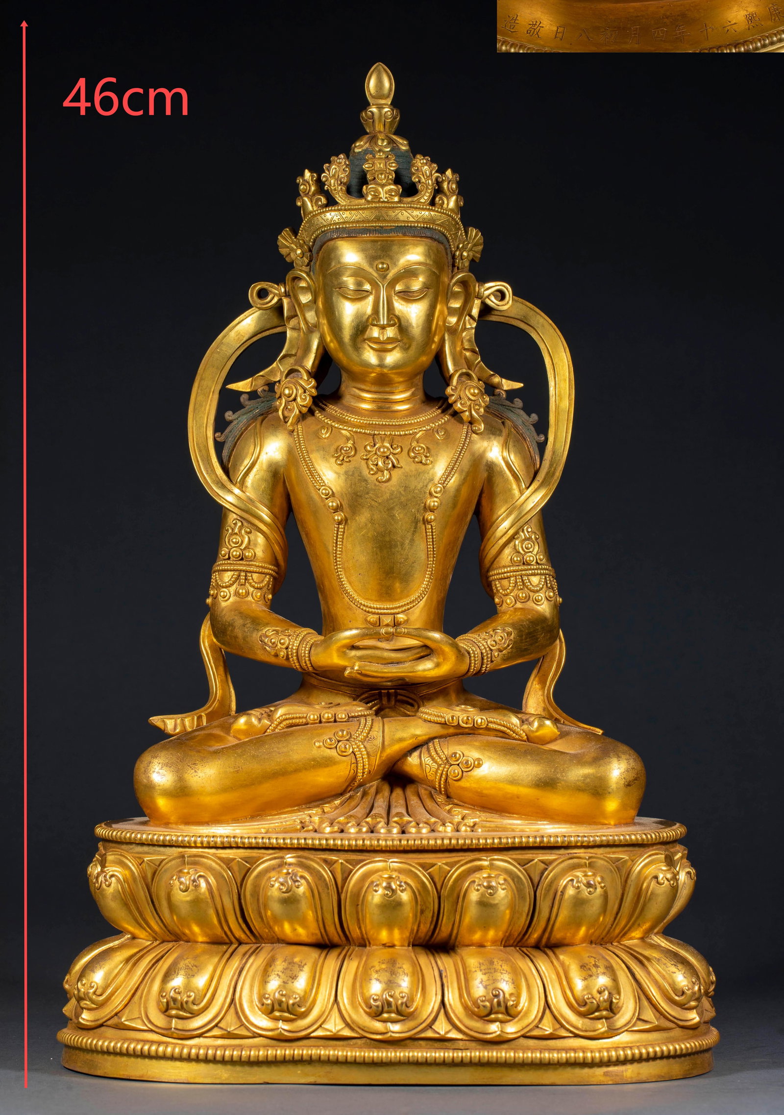 Qing Kangxi Gilt Copper Amitayus: A Qing Kangxi gilt-copper Amitayus, seated in lotus position holding a vase, solemn and kindly. Gilded throughout with fine craft ?? a Qing court-style image. H 46 cm, L 29 cm, W 22 cm, 14150 g.