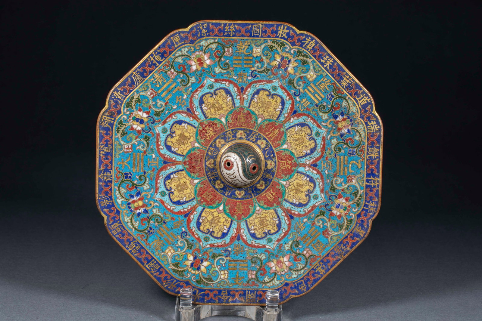 Qianlong Cloisonne Yin-Yang Bagua Mirror: A Qianlong cloisonne mirror whose back is painted with yin-yang and bagua motifs in bright enamels. A display or ritual mirror with Taoist cultural meaning. T 3 cm, Diameter 24 cm, 3879 g.