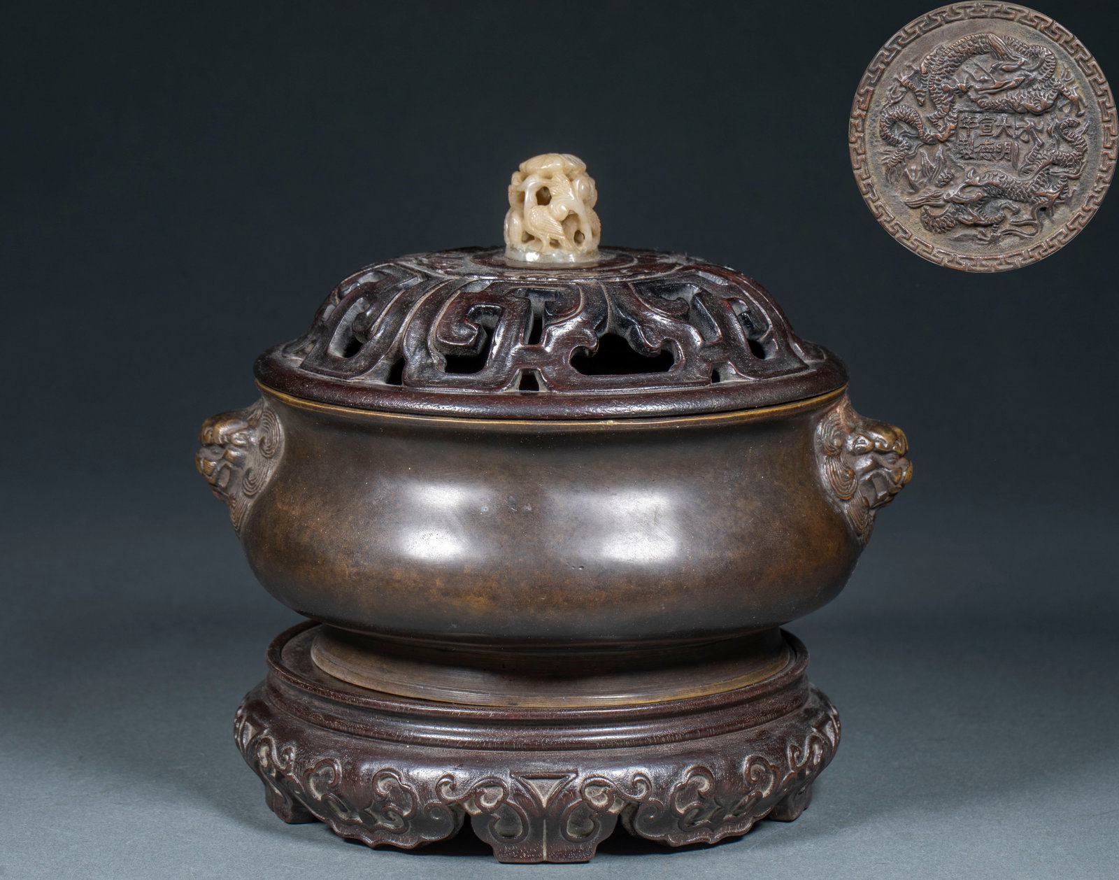 Xuande Dragon-Beast-Ear Incense Burner: A Xuande dragon-beast-ear incense burner with dragon decoration and beast ears at the sides, on feet. Pure copper with fierce decoration ?? a celebrated imitation-Xuande burner. H 19 cm, L 20 cm, W