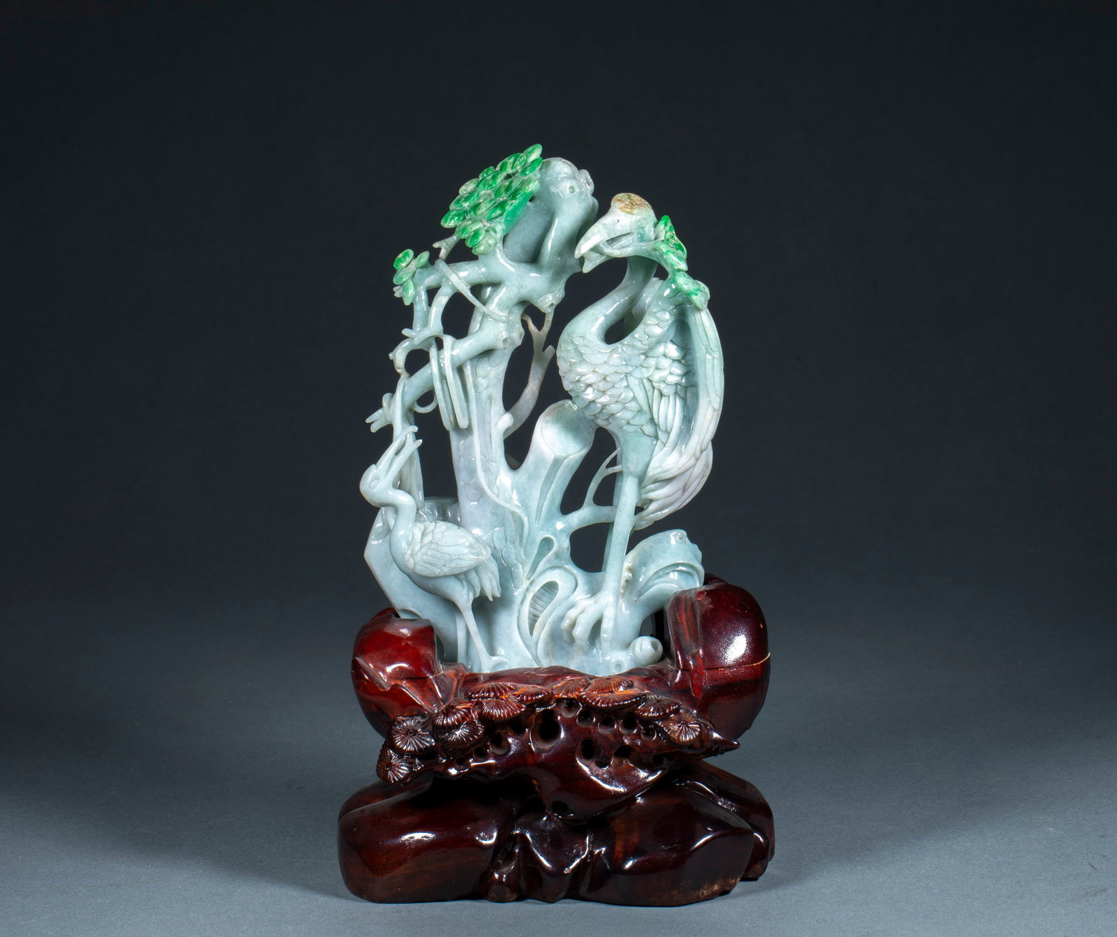 Jadeite Pine-Crane Extending-Years Ornament: A jadeite ornament carved with an old pine and cranes, symbolising long life extended. Green and warm, finely carved ?? a fine desk piece. H 20 cm, L 13 cm, W 15 cm, 1168 g.