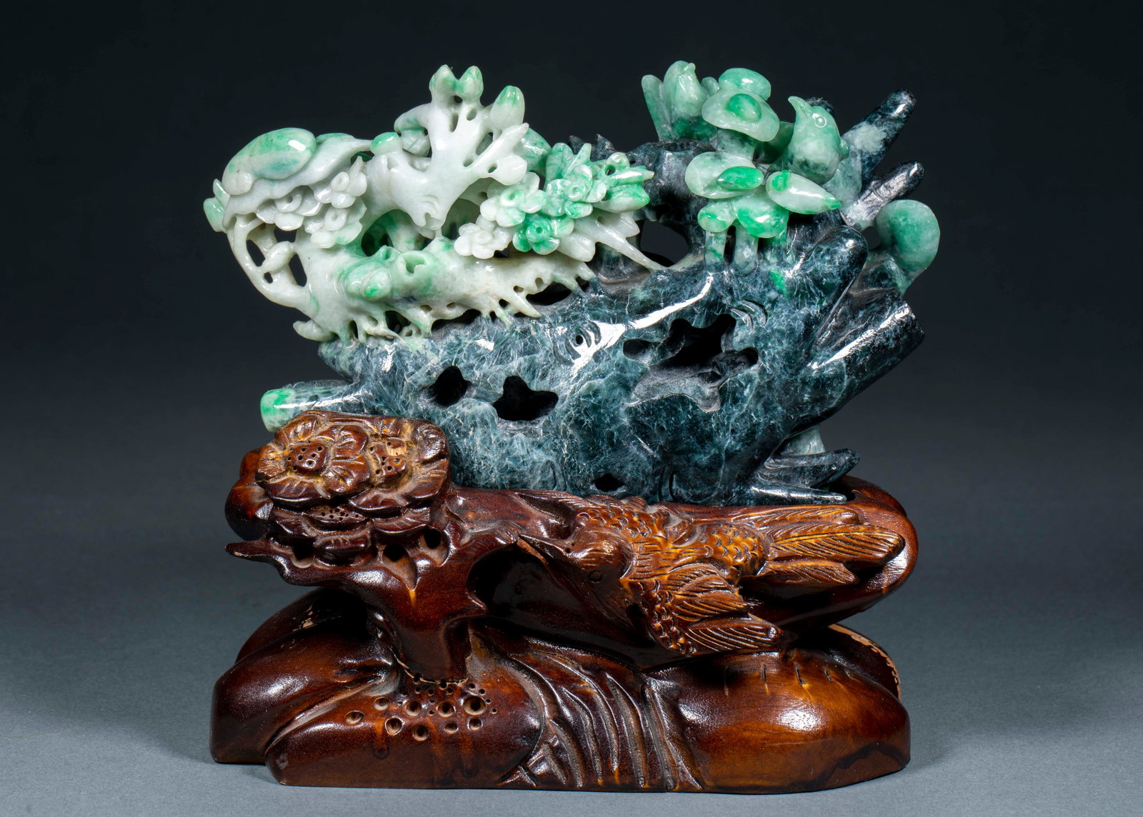 Jadeite 'Joy on the Branch' Mountain-Form Ornament: A jadeite mountain-form ornament with a magpie perched on a branch, punning on 'joy on the branch', symbolising happy tidings. Green and warm, carved to the natural form ?? a display ornament. H 12