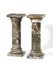 A pair of marble pedestals