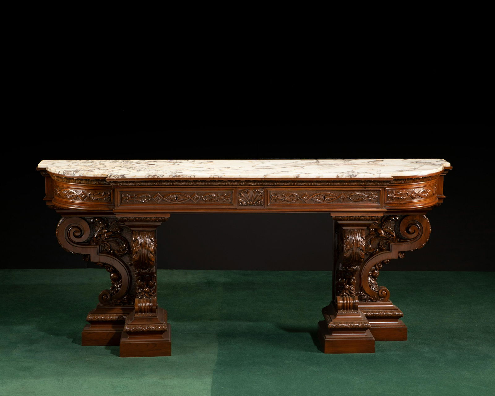 A carved mahogany and marble-top console table (1 of 4)