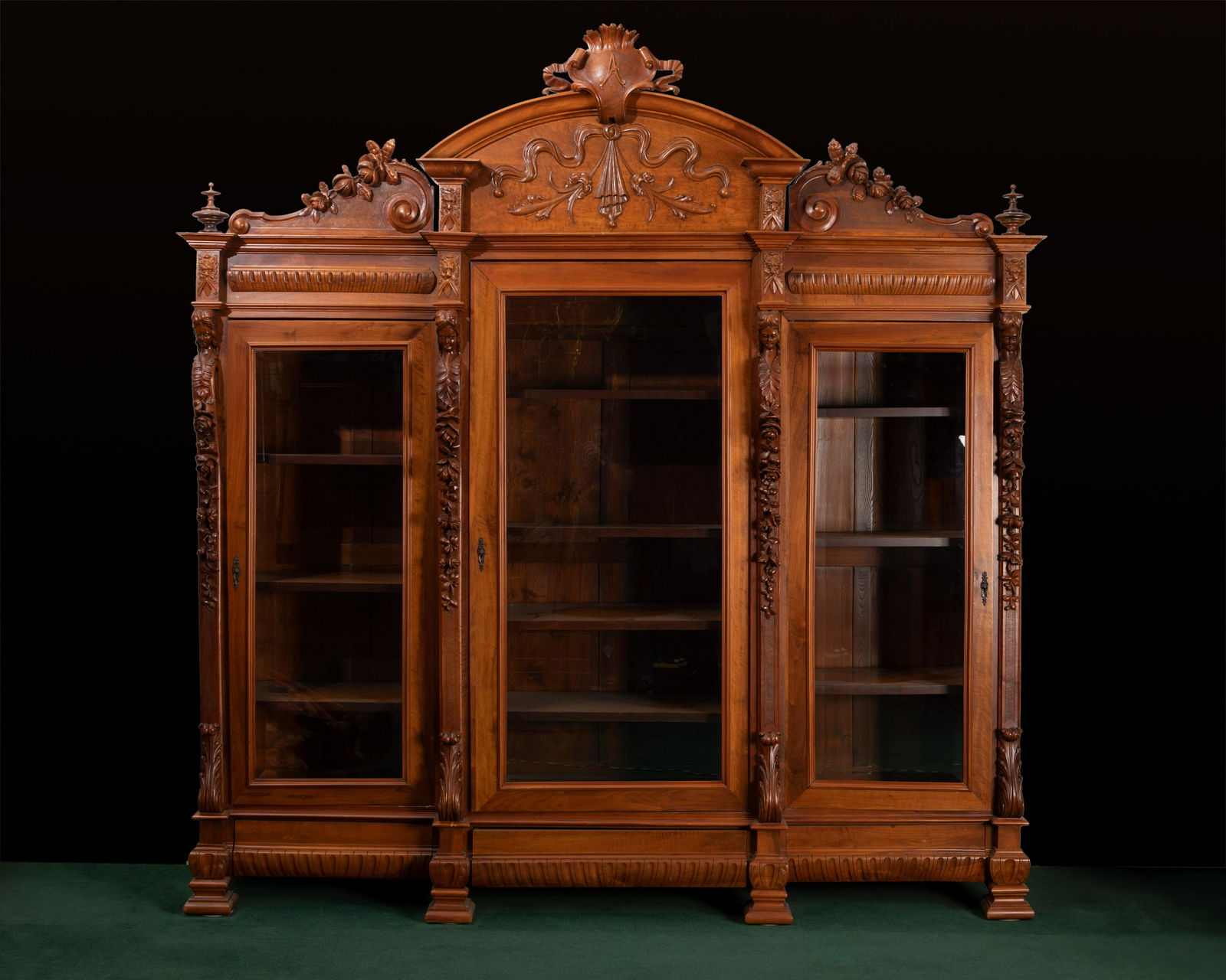 A monumental three-door walnut bookcase (1 of 3)