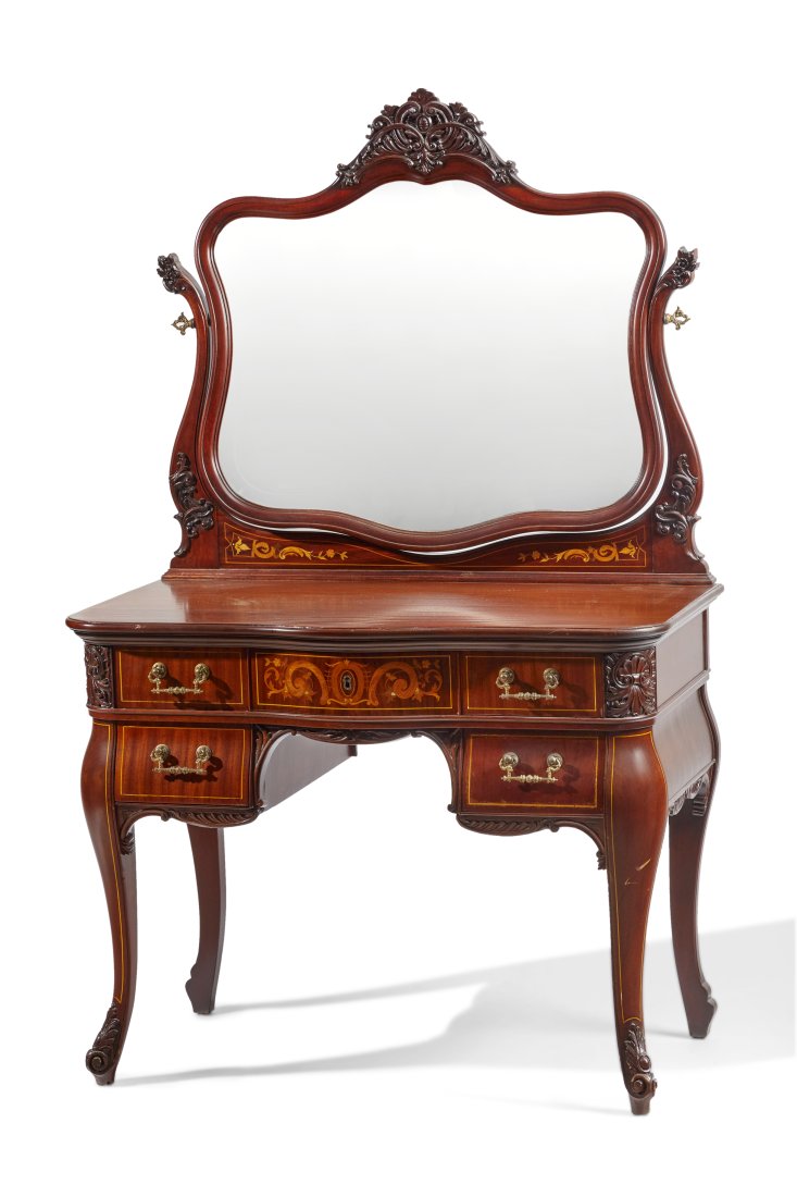 An American R.J. Horner vanity with mirror: An American R.J. Horner vanity with mirror Early 20th century R.J. Horner, NY label affixed to verso Carved mahogany with serpentine shaped mirror with carved central crest on hinged harp-style framed