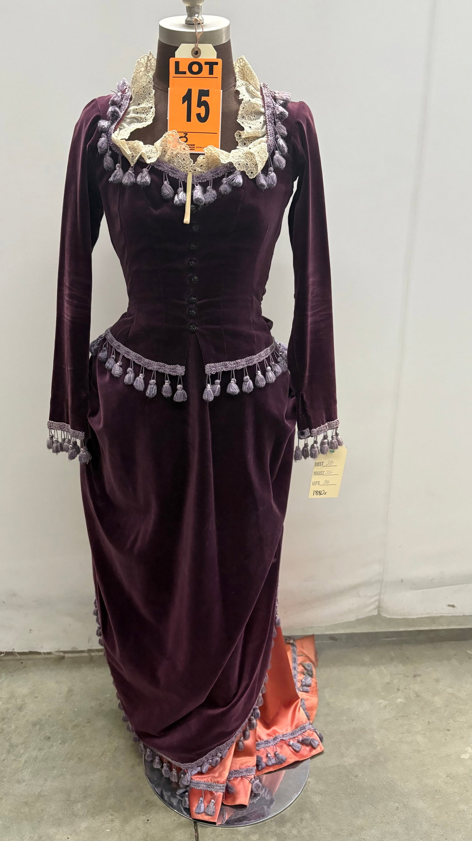 Bustle dress, 1880, purple velvet, tassel trim, studio made.: Bustle dress, 1880, purple velvet, tassel trim, studio made. IMPORTANT NOTE TO BIDDERS: We are not an auction gallery but a liquidator retained by CRC as they wind-down operations. As such, we cannot 