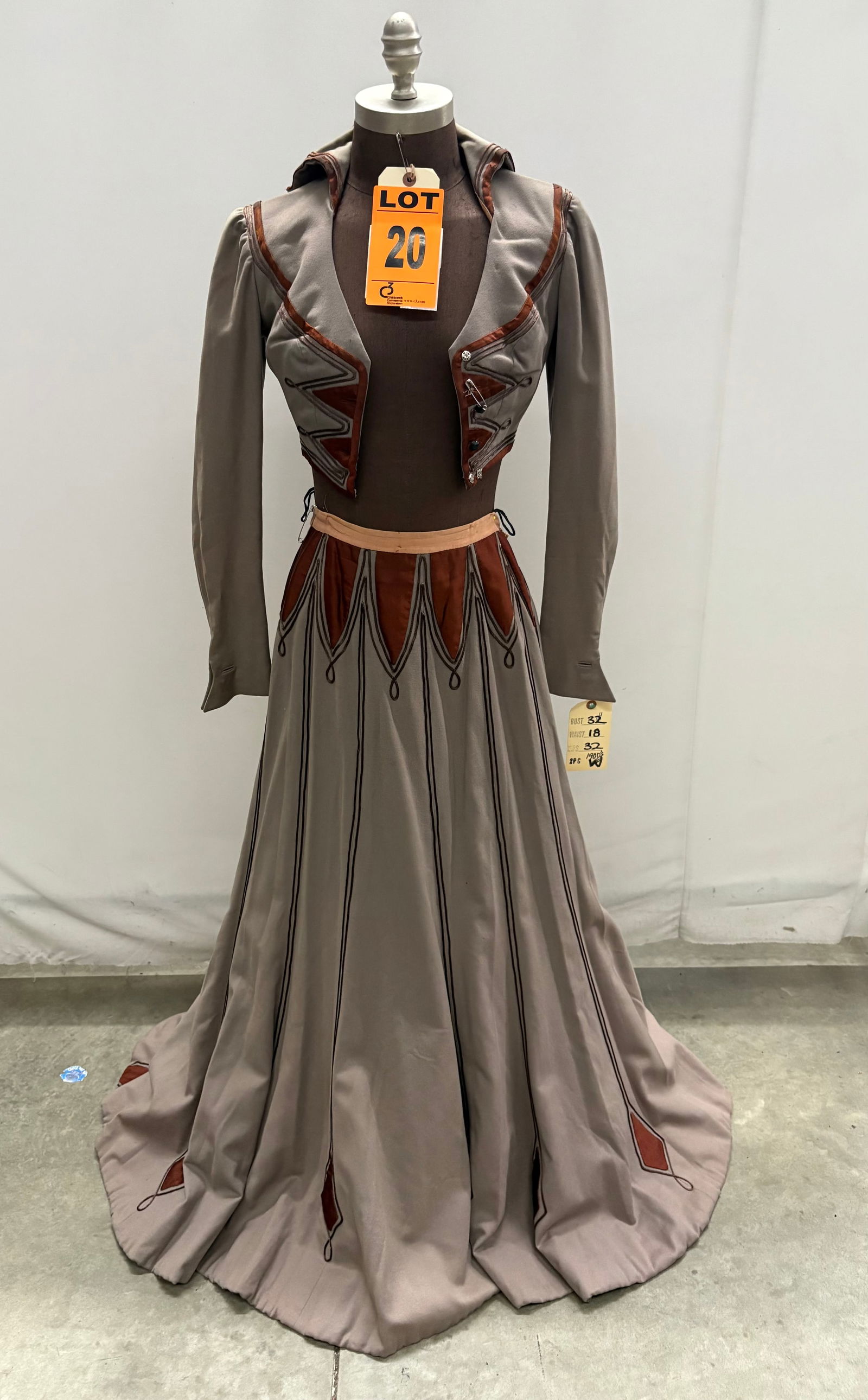 Suit, 1900, taupe wool with brown silk faille, rat-tail trim, studio made.: Suit, 1900, taupe wool with brown silk faille, rat-tail trim, studio made. IMPORTANT NOTE TO BIDDERS: We are not an auction gallery but a liquidator retained by CRC as they wind-down operations. As su