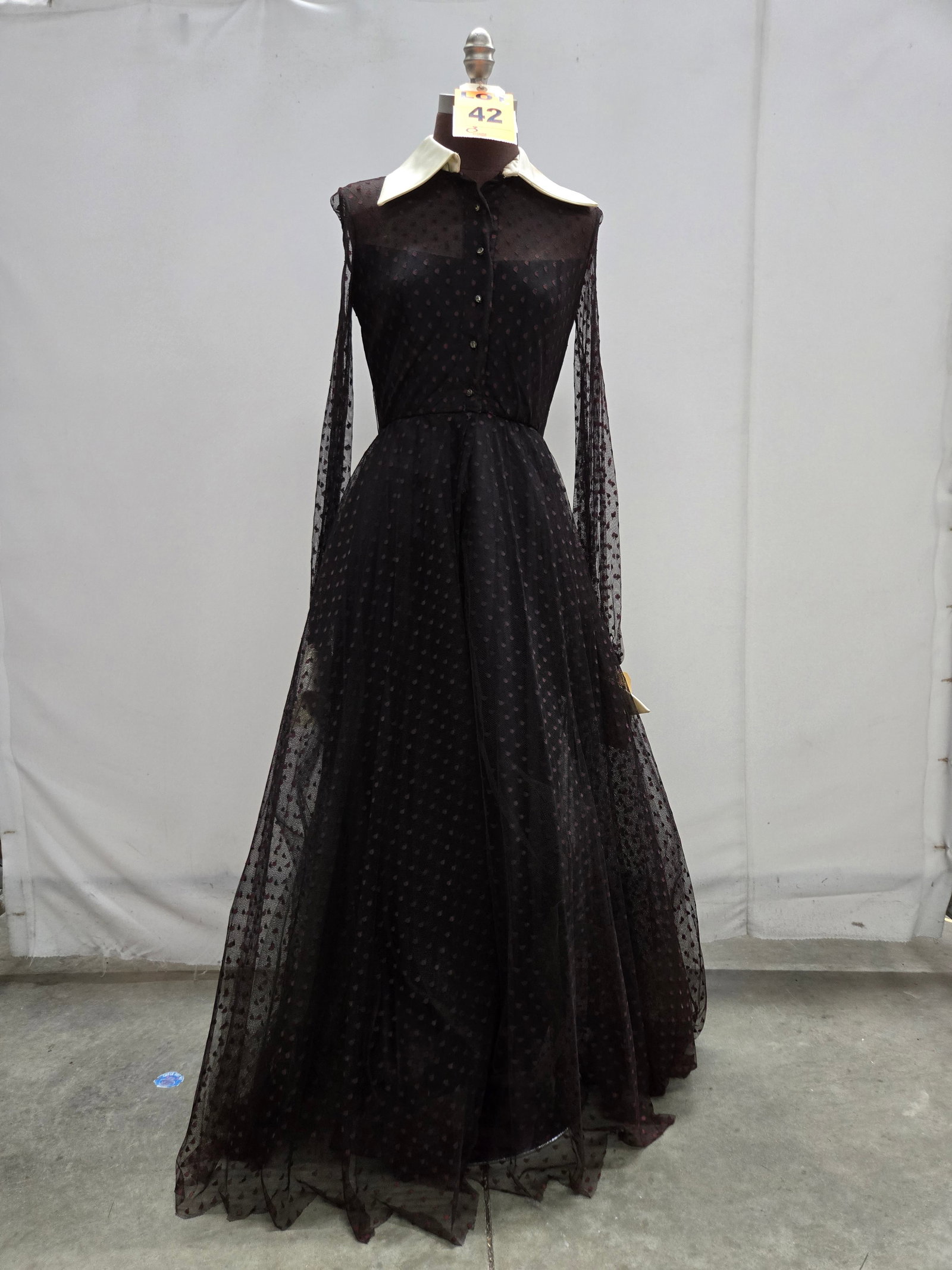 Evening gown, 1970s, black dotted net, long sleeves with rhinestone buttons and cream satin collar/c (1 of 6)