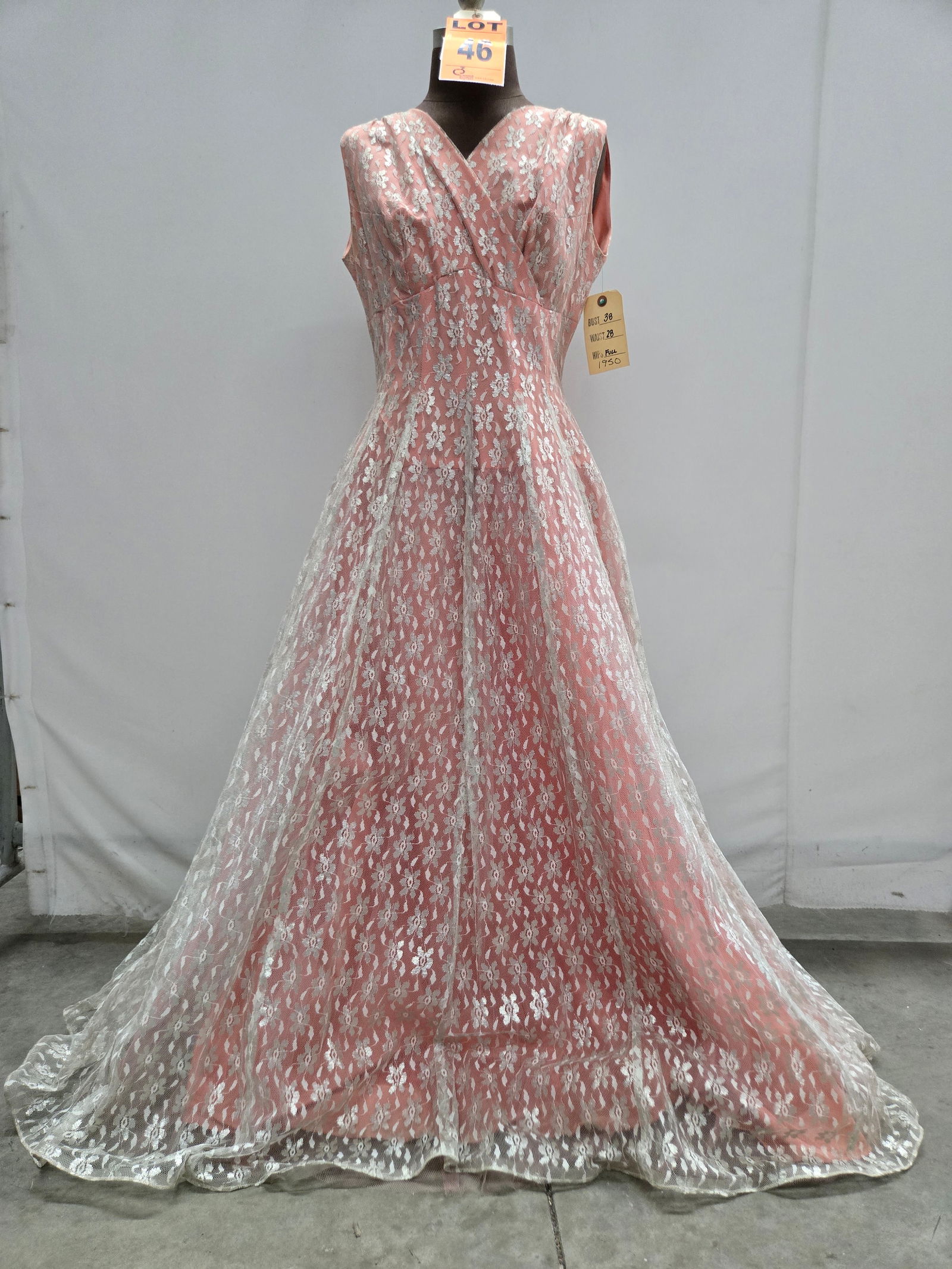 Evening gown, 1950s, silver floral lace over hot-pink taffeta, n/a.: Evening gown, 1950s, silver floral lace over hot-pink taffeta, n/a. IMPORTANT NOTE TO BIDDERS: We are not an auction gallery but a liquidator retained by CRC as they wind-down operations. As such, we