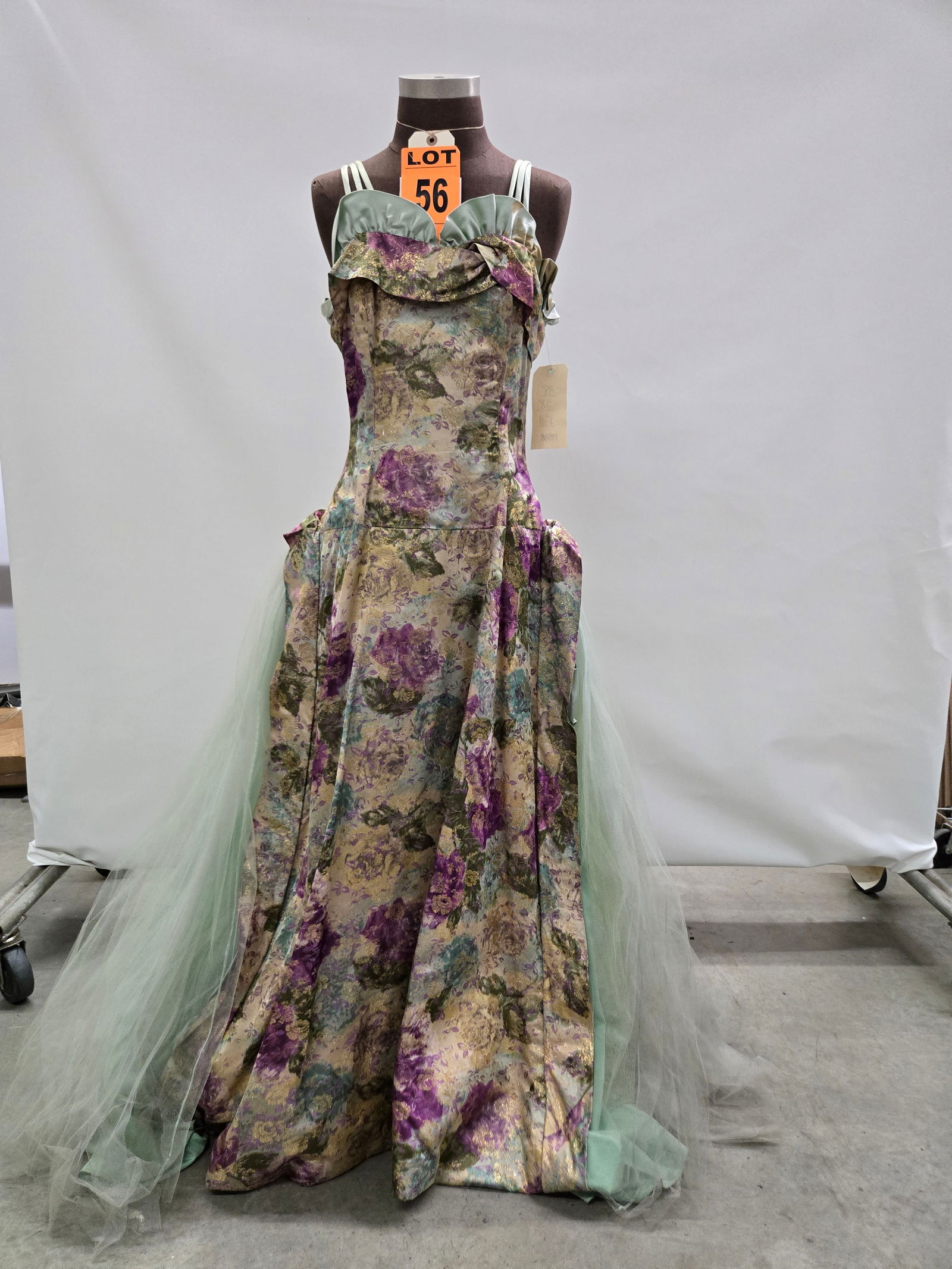 Evening gown, 1950s, purple/gold/green metallic floral brocade, multilayer green net over green irid (1 of 5)