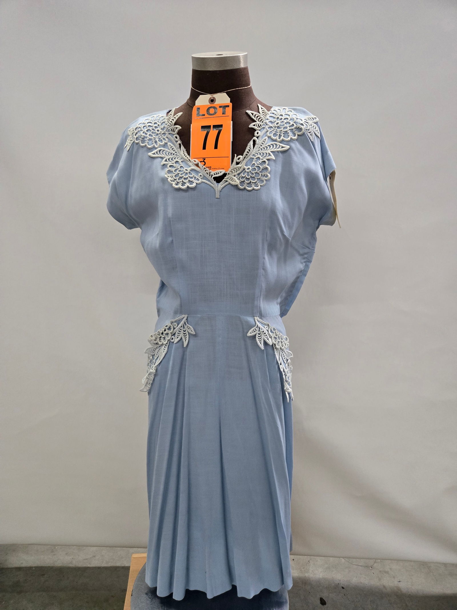 Day dress, 1950s, blue cotton, blue floral appliqué trim, by Paul Sachs Original.: Day dress, 1950s, blue cotton, blue floral appliqué trim, by Paul Sachs Original. IMPORTANT NOTE TO BIDDERS: We are not an auction gallery but a liquidator retained by CRC as they wind-down opera