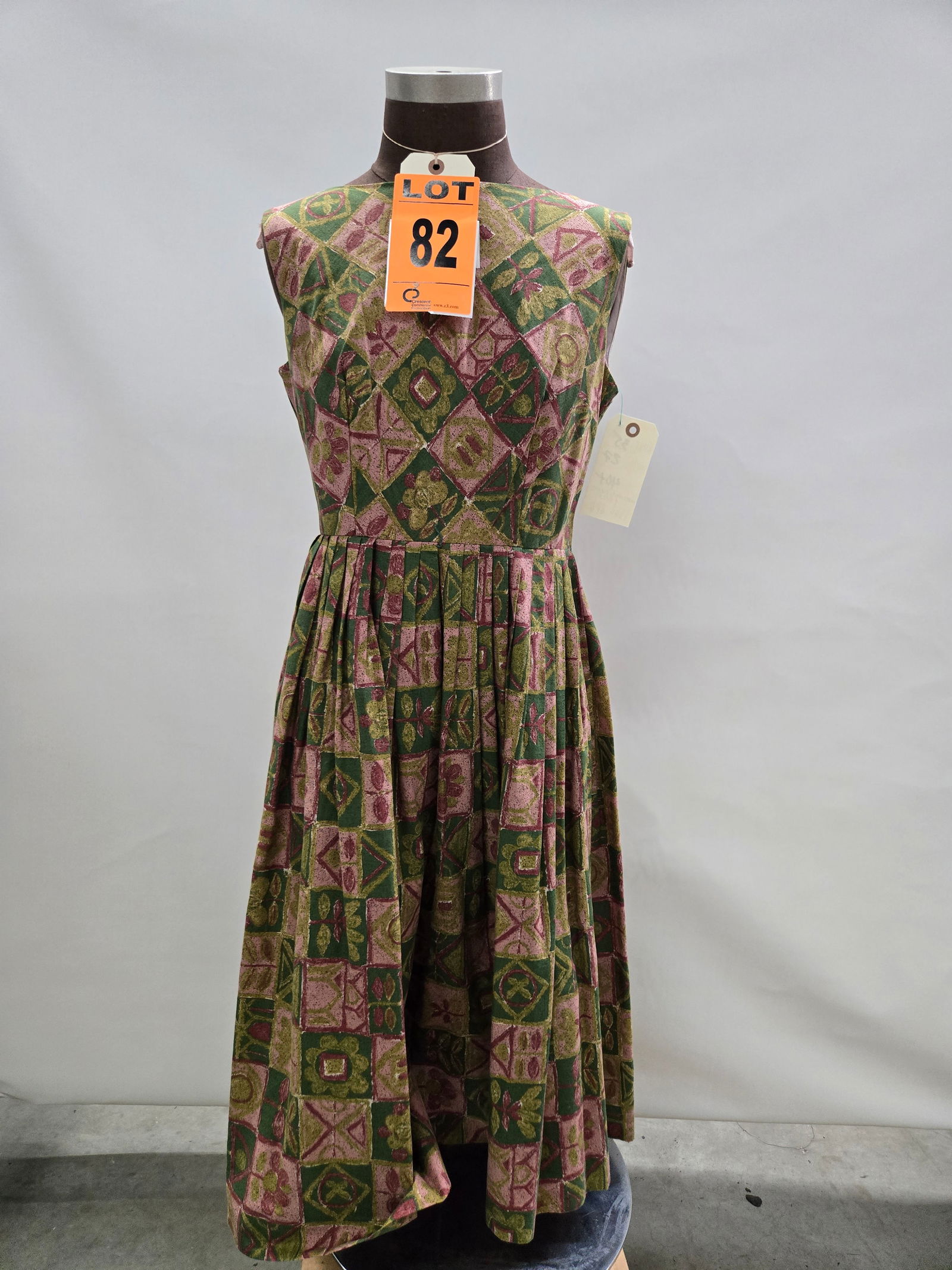 Day dress, 1950s, green/brick/mauve leaves and floral print, sleeveless with pleated skirt. (1 of 4)