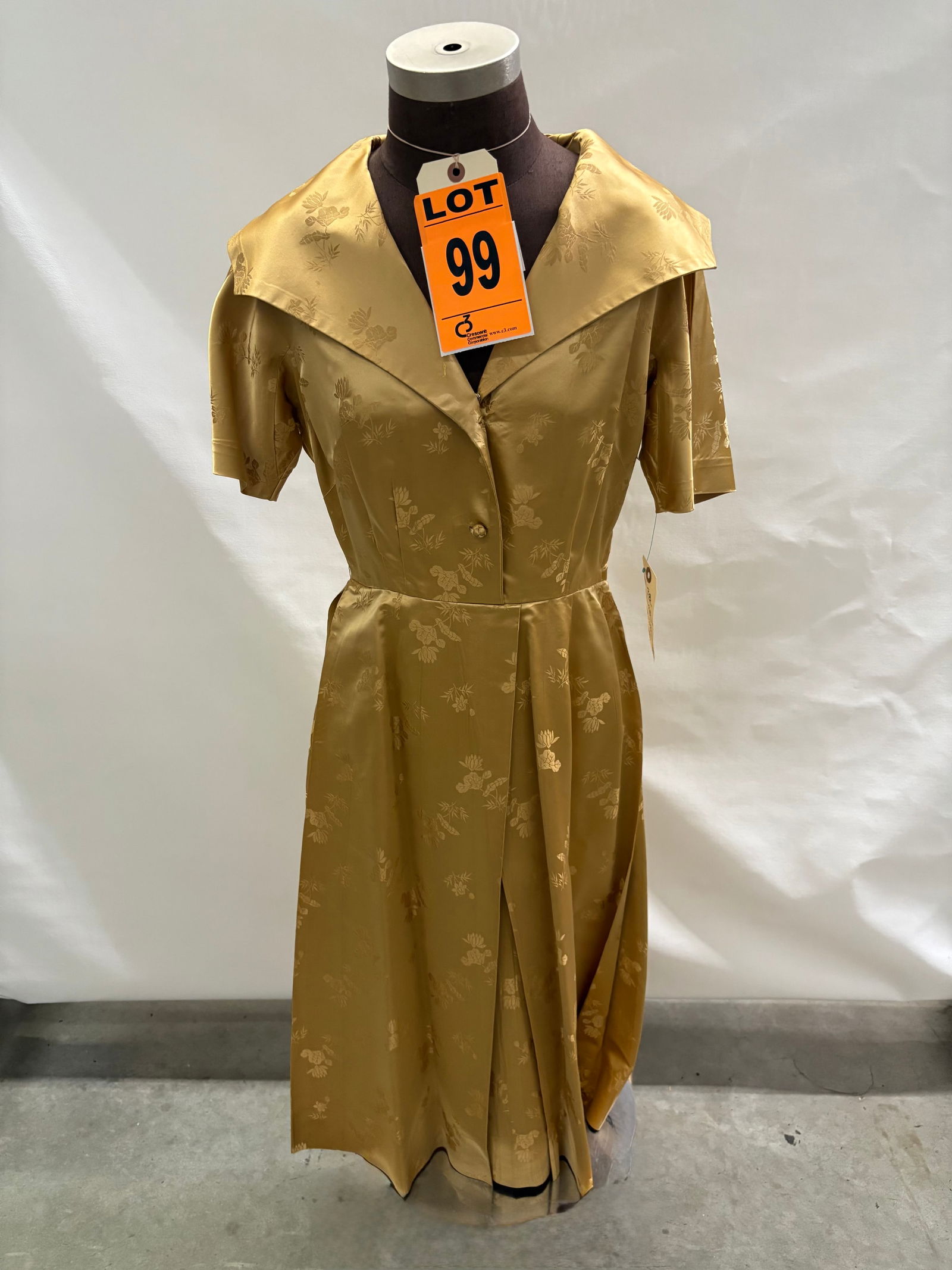Cocktail dress set, 1950s, gold floral silk brocade two-piece with matching belt, by Dynasty.: Cocktail dress set, 1950s, gold floral silk brocade two-piece with matching belt, by Dynasty. IMPORTANT NOTE TO BIDDERS: We are not an auction gallery but a liquidator retained by CRC as they wind-dow