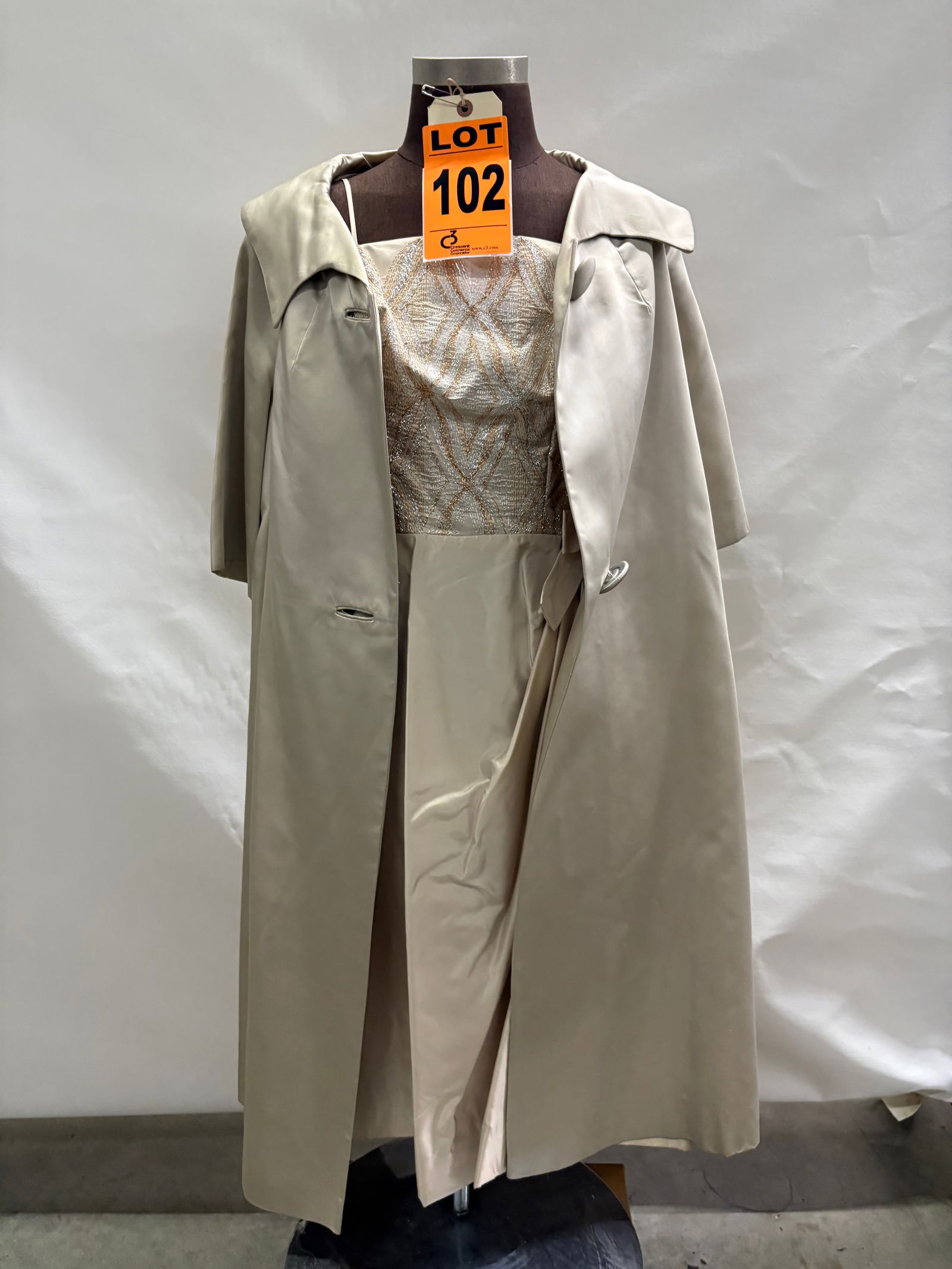Cocktail dress set, 1950s, cream taffeta skirt with silver/gold lamé bodice and beige silk swin: Cocktail dress set, 1950s, cream taffeta skirt with silver/gold lamé bodice and beige silk swing coat, two-piece. IMPORTANT NOTE TO BIDDERS: We are not an auction gallery but a liquidator retaine