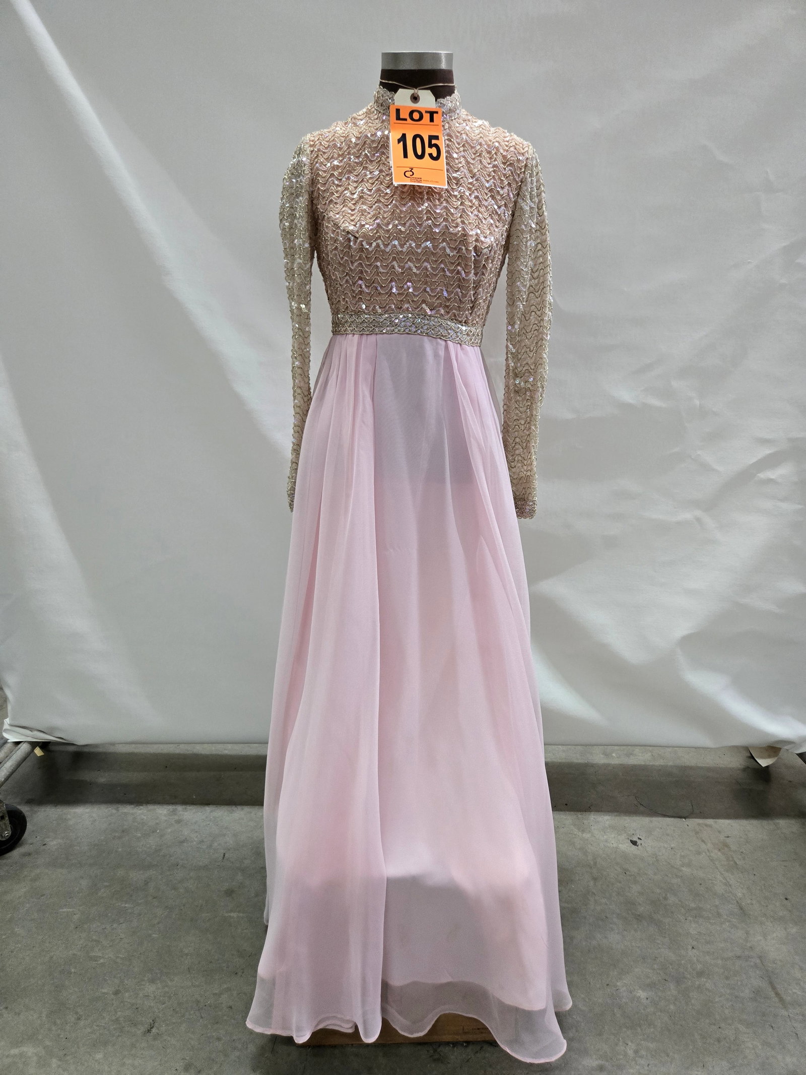 Evening gown, 1960s, pink chiffon skirt with sequin/gold zig-zag bodice, long sleeve, by Jack Bryan.: Evening gown, 1960s, pink chiffon skirt with sequin/gold zig-zag bodice, long sleeve, by Jack Bryan. IMPORTANT NOTE TO BIDDERS: We are not an auction gallery but a liquidator retained by CRC as they w