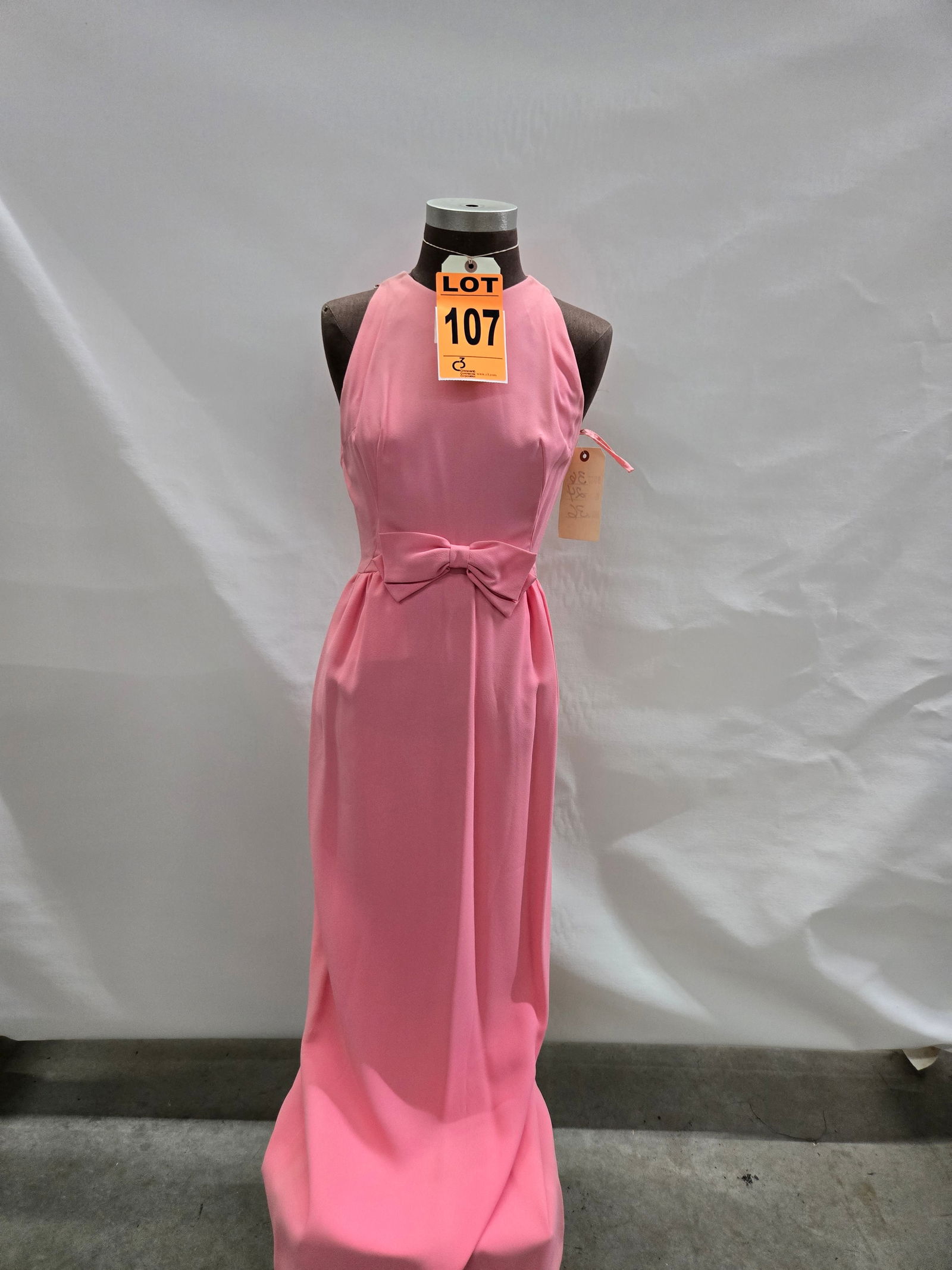 Evening gown, 1960s, brown silk chiffon, bow at waist, by Lisa Meril.: Evening gown, 1960s, brown silk chiffon, bow at waist, by Lisa Meril. IMPORTANT NOTE TO BIDDERS: We are not an auction gallery but a liquidator retained by CRC as they wind-down operations. As such, w