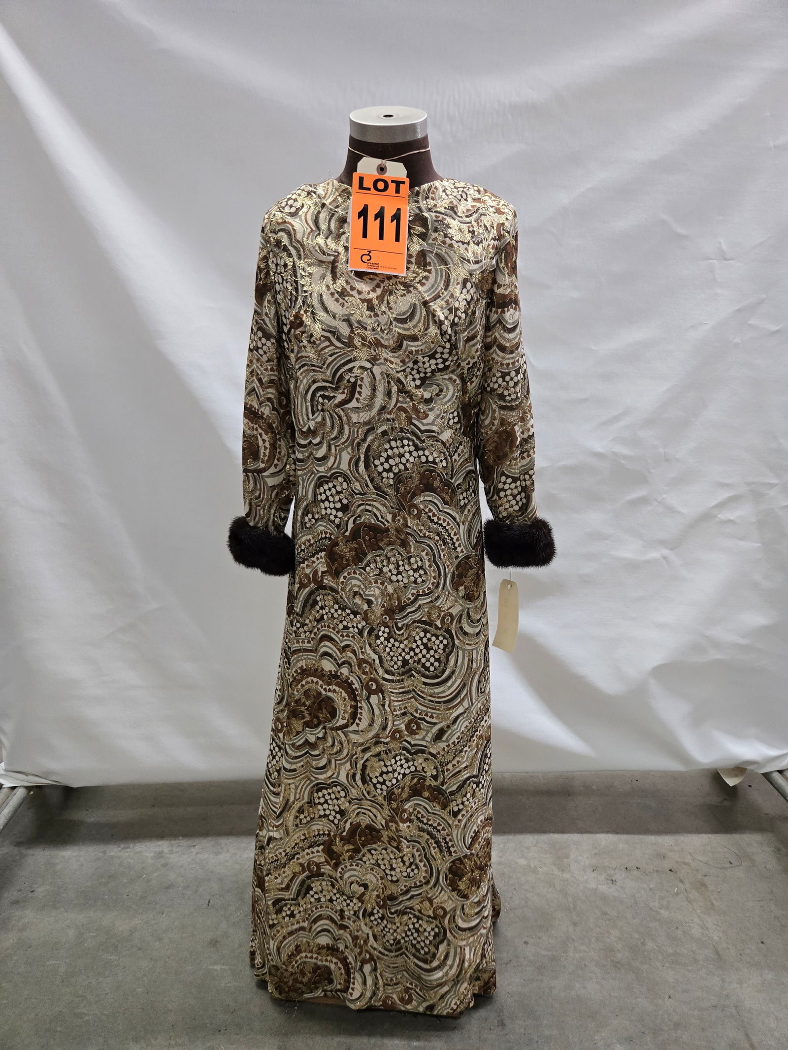Evening gown, 1960s, cream/grey/brown metallic-gold floral brocade, mink-trim cuffs. (1 of 5)