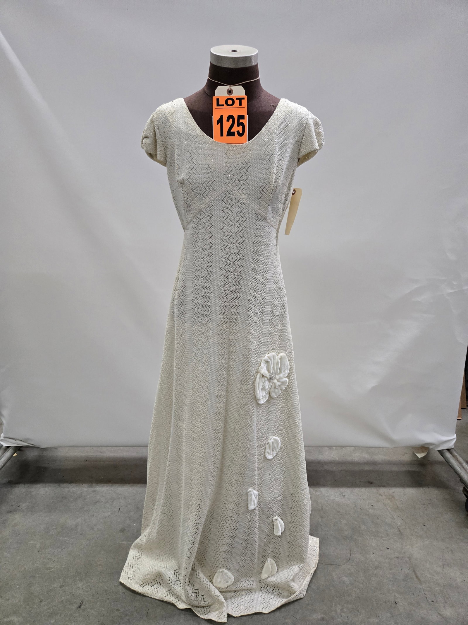 Evening gown, 1960s, cream/silver crochet stripes, 3-D white velvet rose on skirt.: Evening gown, 1960s, cream/silver crochet stripes, 3-D white velvet rose on skirt. IMPORTANT NOTE TO BIDDERS: We are not an auction gallery but a liquidator retained by CRC as they wind-down operation