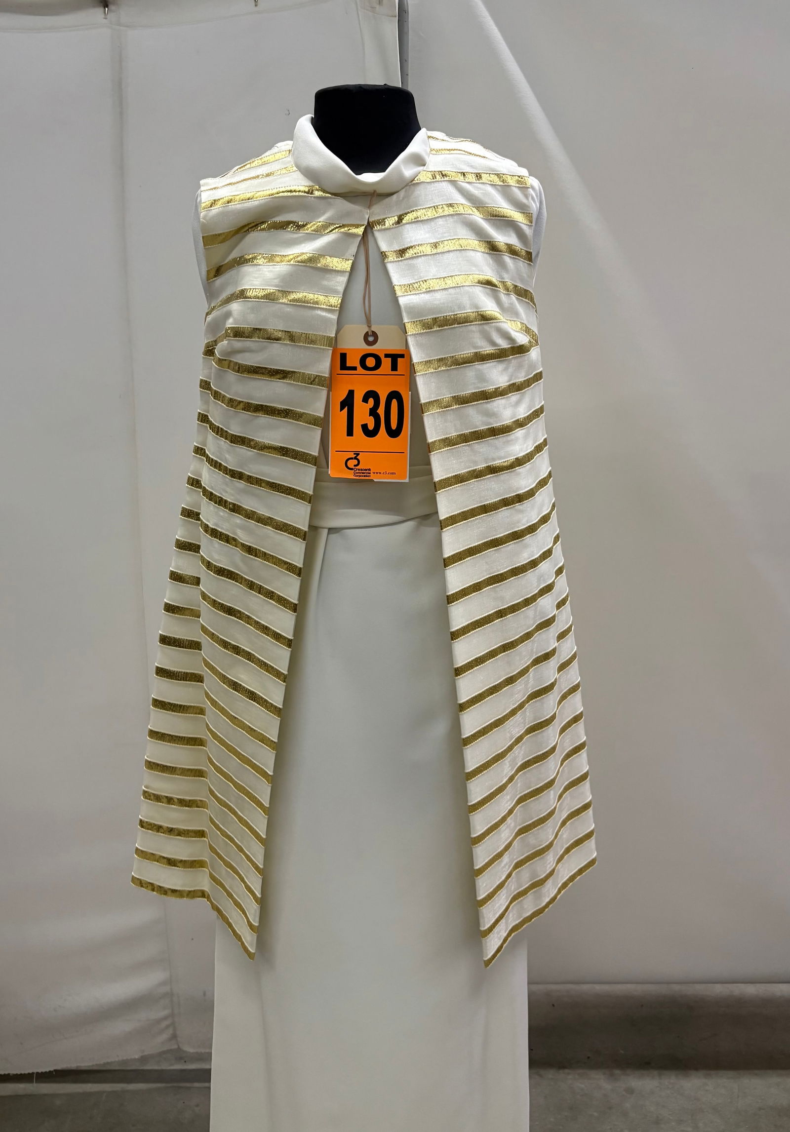 Evening gown set, 1960s, white polyester long-sleeve sheath with attached belt and white/gold lam: Evening gown set, 1960s, white polyester long-sleeve sheath with attached belt and white/gold lamé striped long vest, by Faye-Renee. IMPORTANT NOTE TO BIDDERS: We are not an auction gallery but a liq