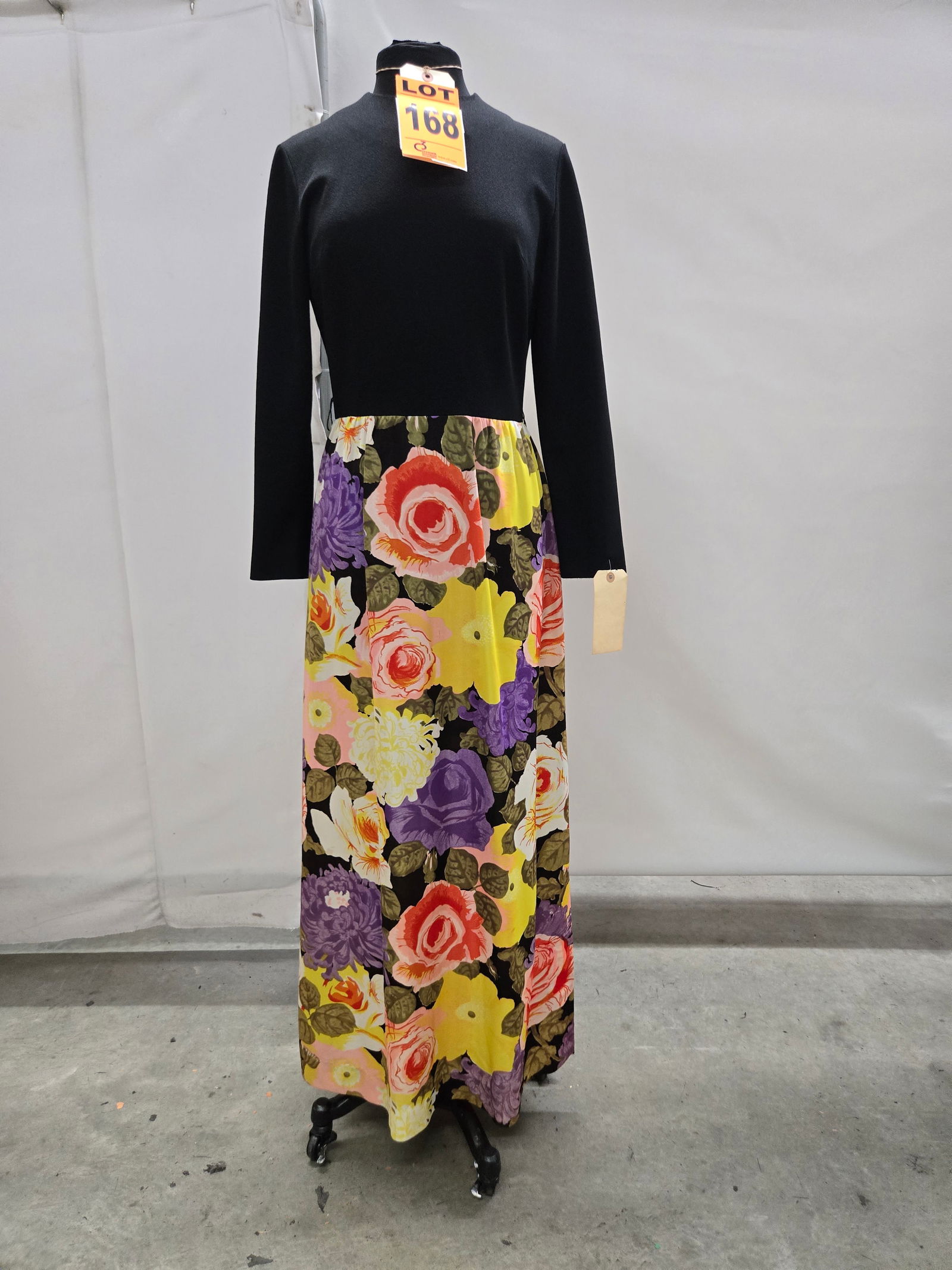 Evening gown, 1970s, black polyester long-sleeve top with multicolor floral jersey skirt, by Bleeker (1 of 6)