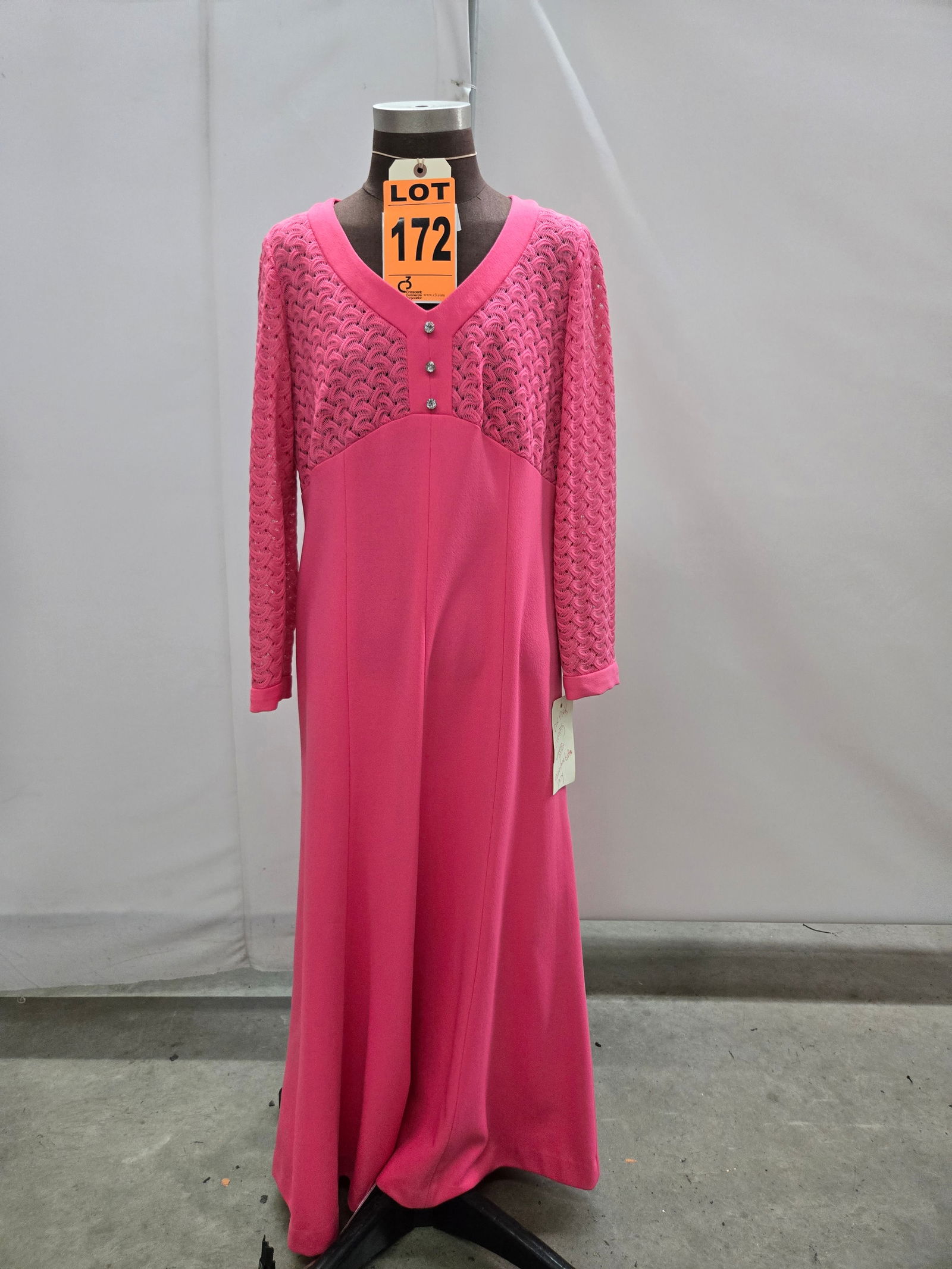 Evening gown, 1970s, bubble-gum pink poly, openwork lace bodice, by Deleon.: Evening gown, 1970s, bubble-gum pink poly, openwork lace bodice, by Deleon. IMPORTANT NOTE TO BIDDERS: We are not an auction gallery but a liquidator retained by CRC as they wind-down operations. As s