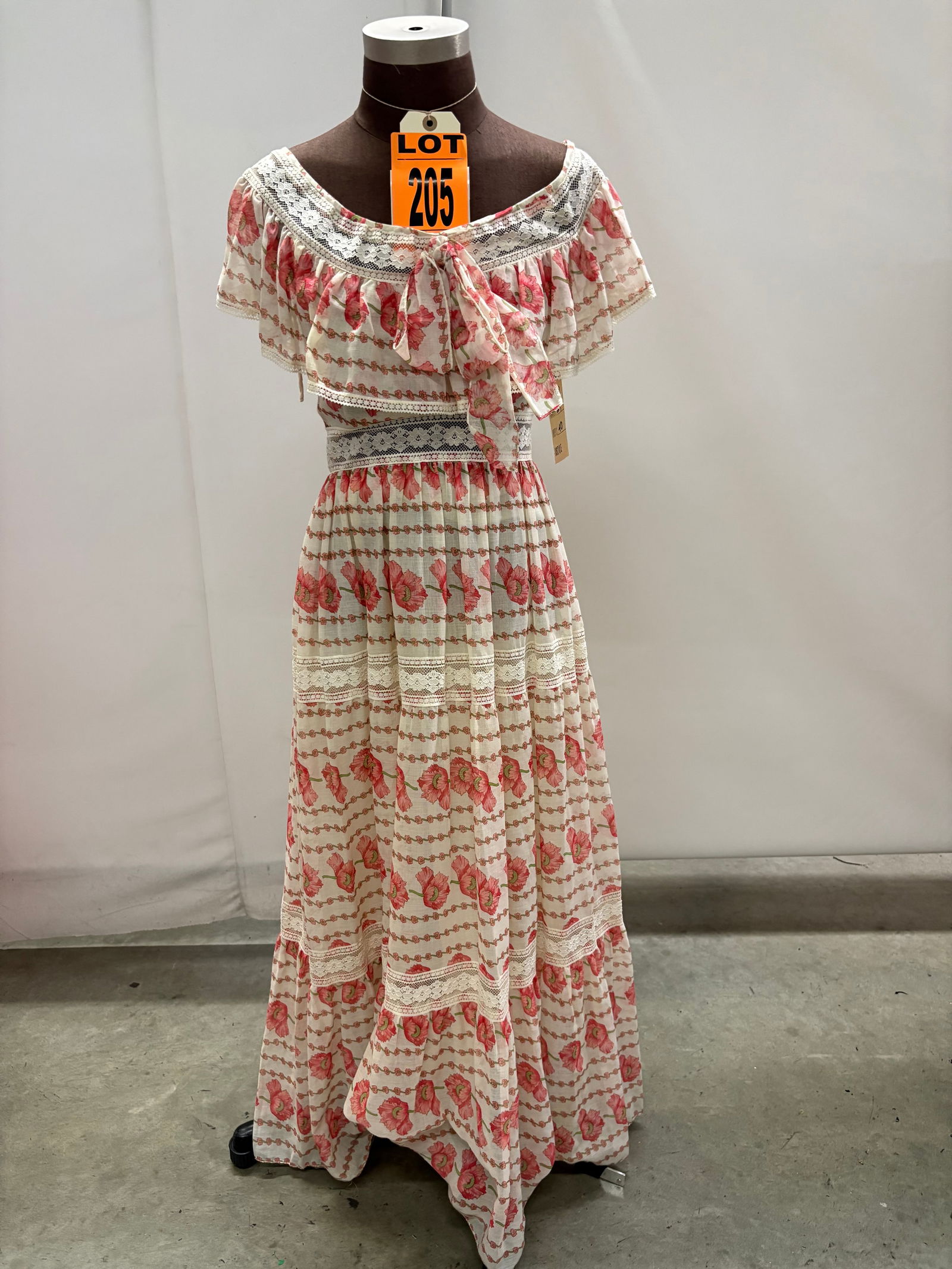 Evening gown, 1970s, cream voile with pink/green flowers, Bertha ruffle at neck with bow center fron (1 of 5)