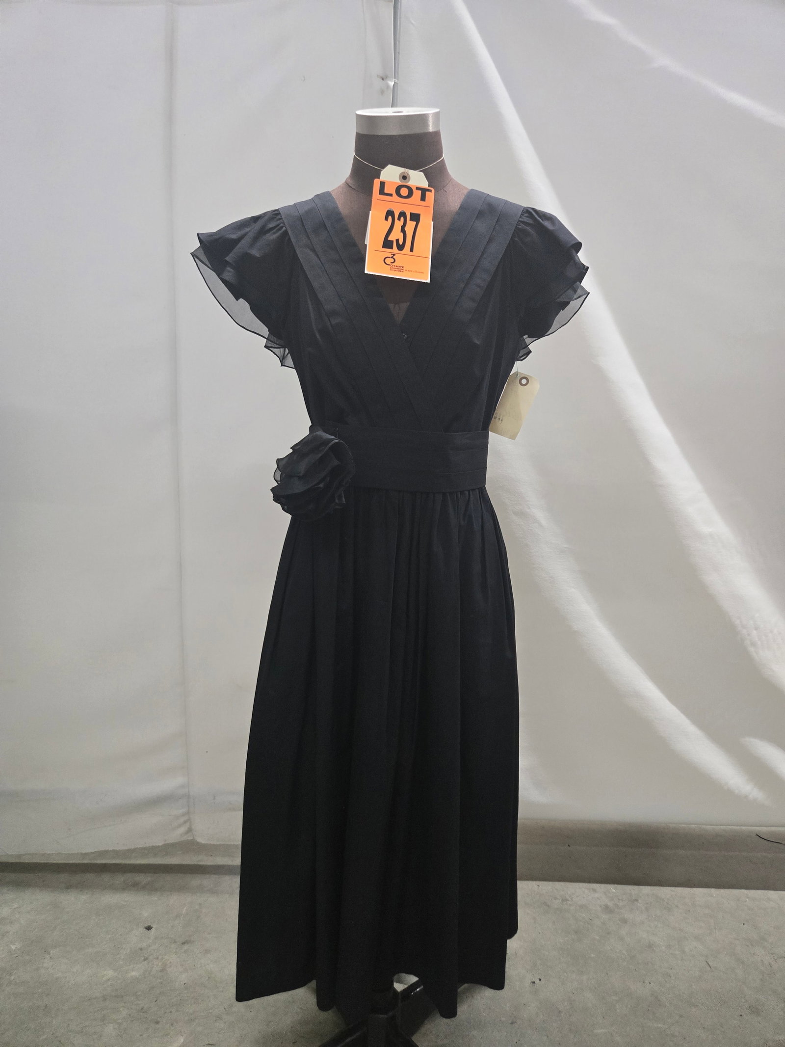 Dress set, 1980s, two-piece with cross-front cummerbund belt and bow, by Rickie Freeman for Teri Jon: Dress set, 1980s, two-piece with cross-front cummerbund belt and bow, by Rickie Freeman for Teri Jon. IMPORTANT NOTE TO BIDDERS: We are not an auction gallery but a liquidator retained by CRC as they 