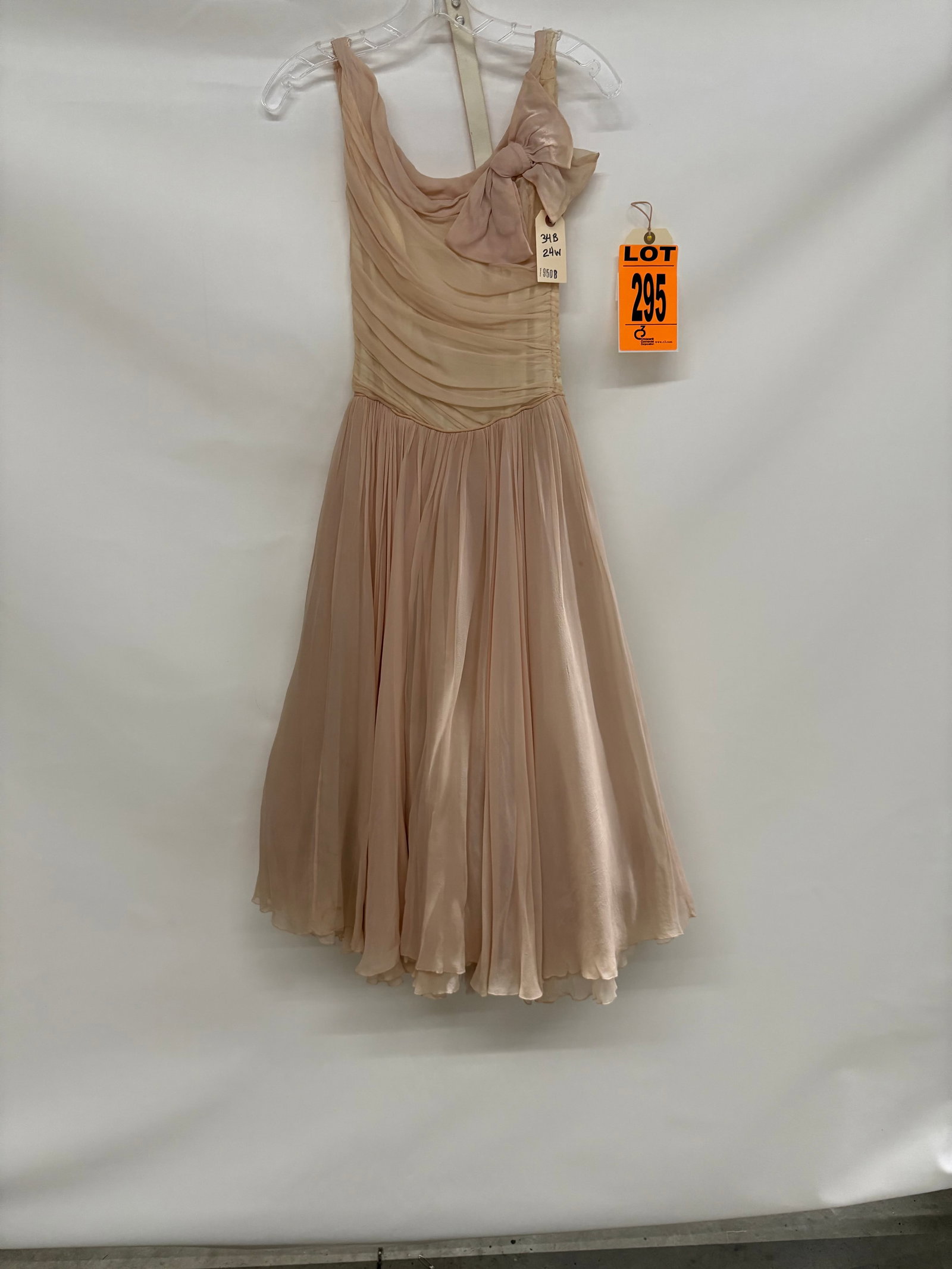 Prom dress set, 1950s, pale-pink silk chiffon, two-piece with bow on left shoulder and self belt. (1 of 3)