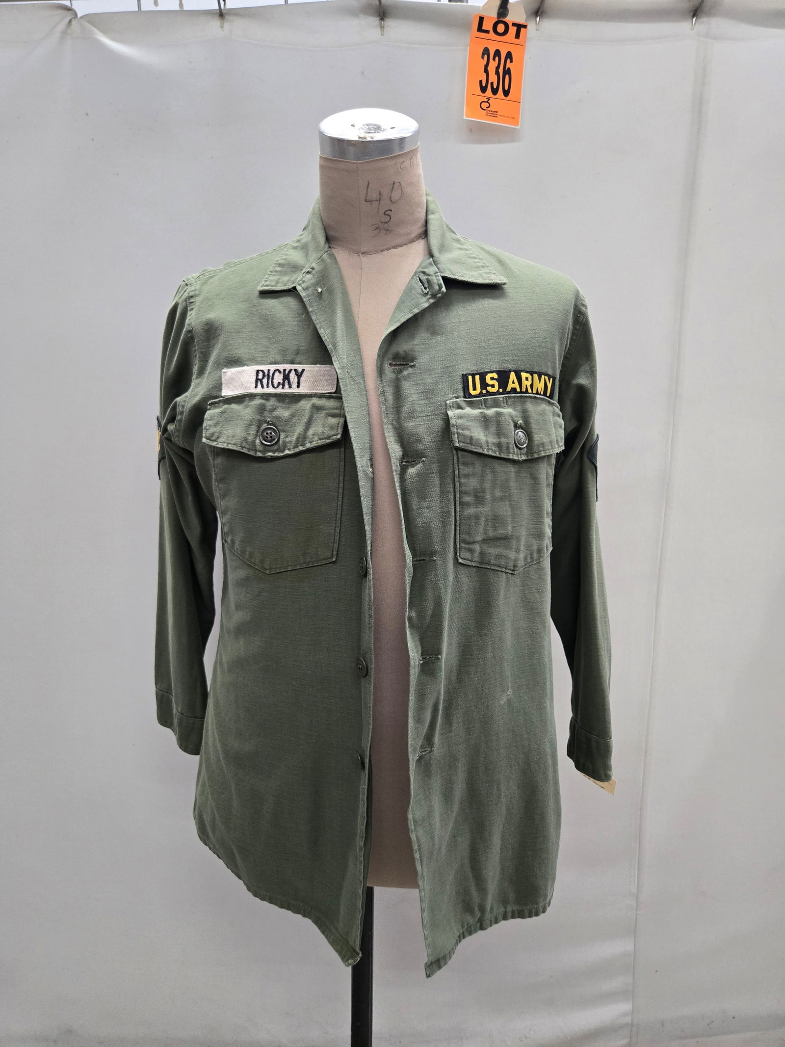 OG107 cotton sateen long sleeve shirt with st Air Cav patch. White cotton name tape RICKY on left: OG107 cotton sateen long sleeve shirt with 1st Air Cav patch. White cotton name tape RICKY on left breast. (1 pcs). featured in We Were Soldiers Location: Row 27A, Item #5 IMPORTANT NOTE TO BIDDERS: W