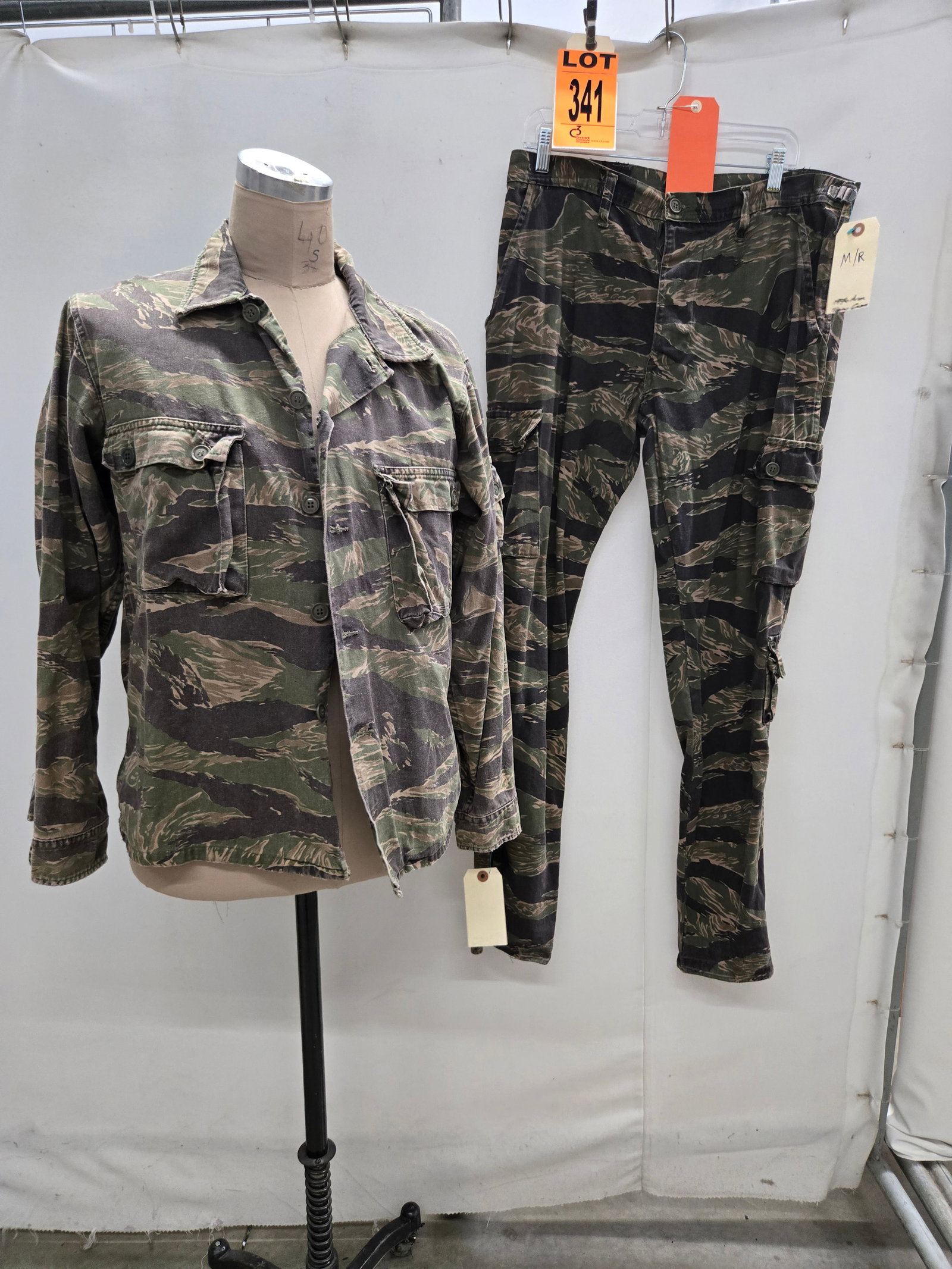 Tiger stripe set made for lead actors stunt double ? Operation Dumbo Drop: Tiger stripe set made for lead actors stunt double, character of Shamus. (2 pcs). featured in Operation Dumbo Drop (1997) Location: Row 27A, Item #10 Note that items attributable to celebrities and pr