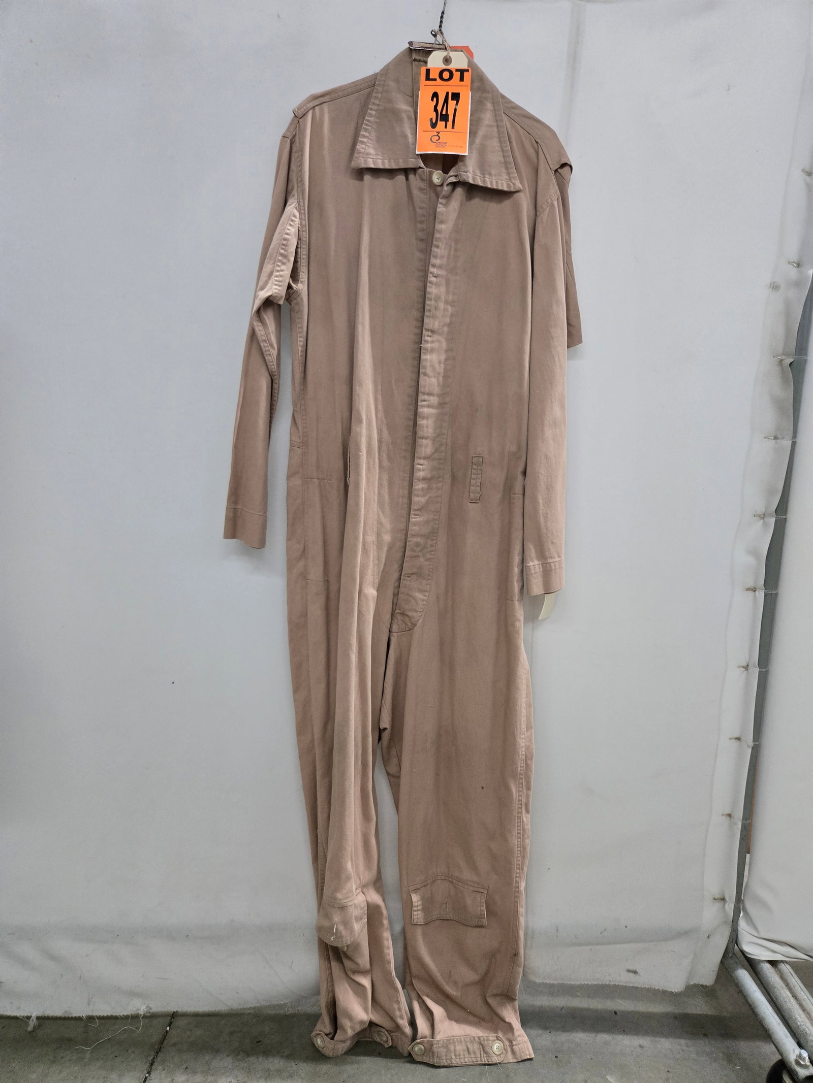 Army Air Corps Flight Suit. Featured in PEARL HARBOR (2001).: Army air corps flight suit, studio made (1 pcs). featured in Pearl Harbor (2001) Location: Row 28A, Item #6 Note that items attributable to celebrities and productions are believed to be accurate base