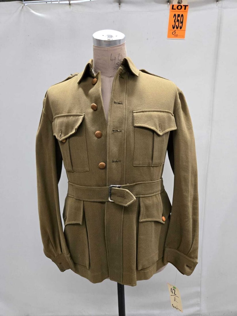 Gaberdine hunting jacket with four pockets and attached waist belt. Size regular. MGM tag in back: Gaberdine hunting jacket with four pockets and attached waist belt. Size 42 regular. MGM tag in back collar. Right epaulette button missing. (1 pcs). dated 1915 Location: Row 29A, Item #2 IMPORTANT NO