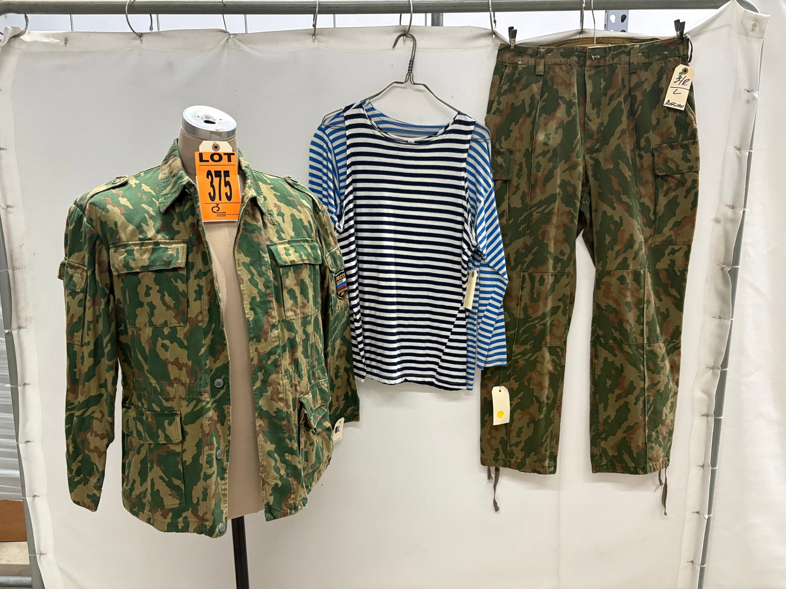 Russian troops apparel sets made for RED DAWN (1984), worn by Russian troops. Jacket.: Russian troops apparel made for RED DAWN (1984), worn by Russian troops. Jacket. One navy marine undershirt and one airborne paratrooper long sleeve undershirt thus camo sets worn by both types of bad