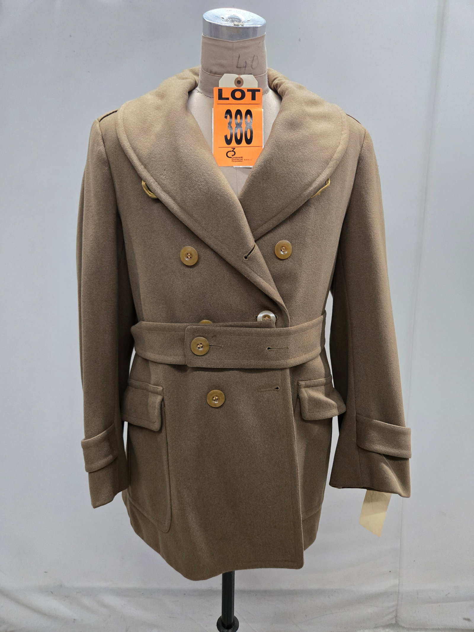 European command o?cers quality tailor made / length coat. Size Complete with waist belt.: European command o?cers quality tailor made 3/4 length coat. Size 38. Complete with waist belt. (1 pcs). dated WWII Location: Row 31A, Item #12 IMPORTANT NOTE TO BIDDERS: We are not an auction gallery
