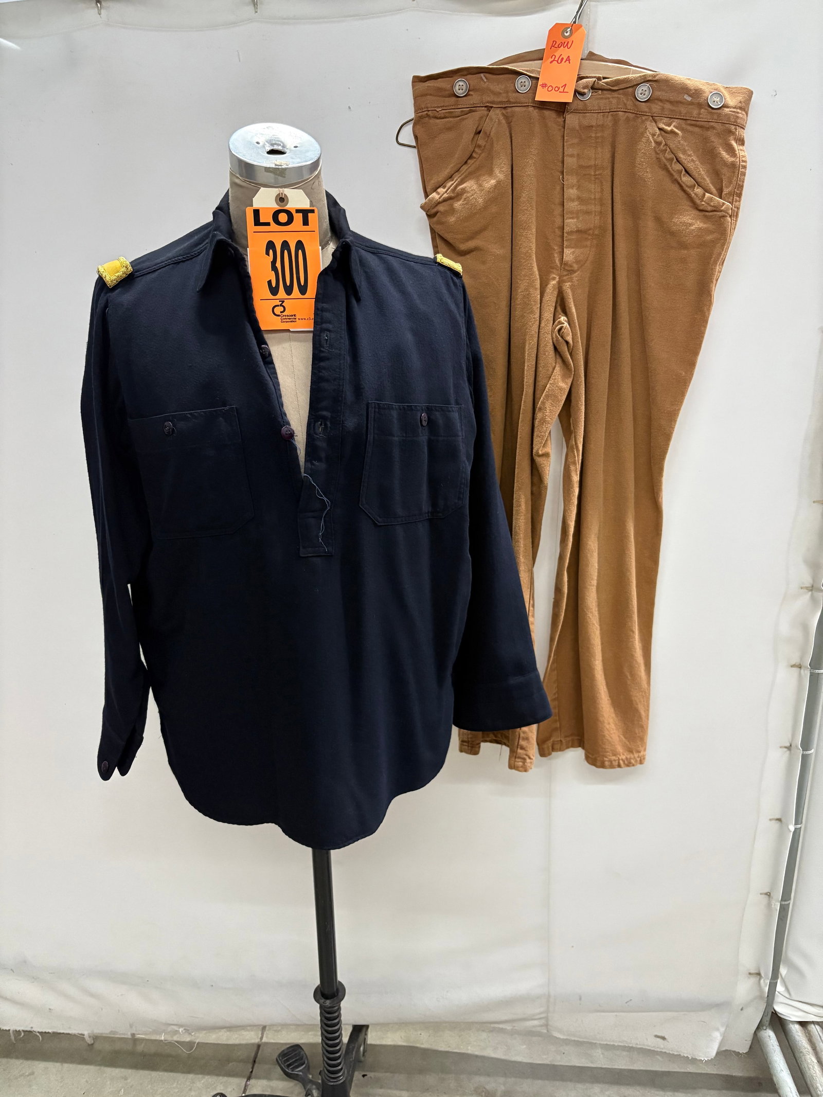 2nd Lieutenant’s Jacket & Trousers (2 pcs). featured in ROUGH RIDERS (1997) Location: Row 26A,: 2nd Lieutenant’s Jacket & Trousers (2 pcs). featured in ROUGH RIDERS (1997) Location: Row 26A, Item #1 IMPORTANT NOTE TO BIDDERS: We are not an auction gallery but a liquidator retained by CRC as th