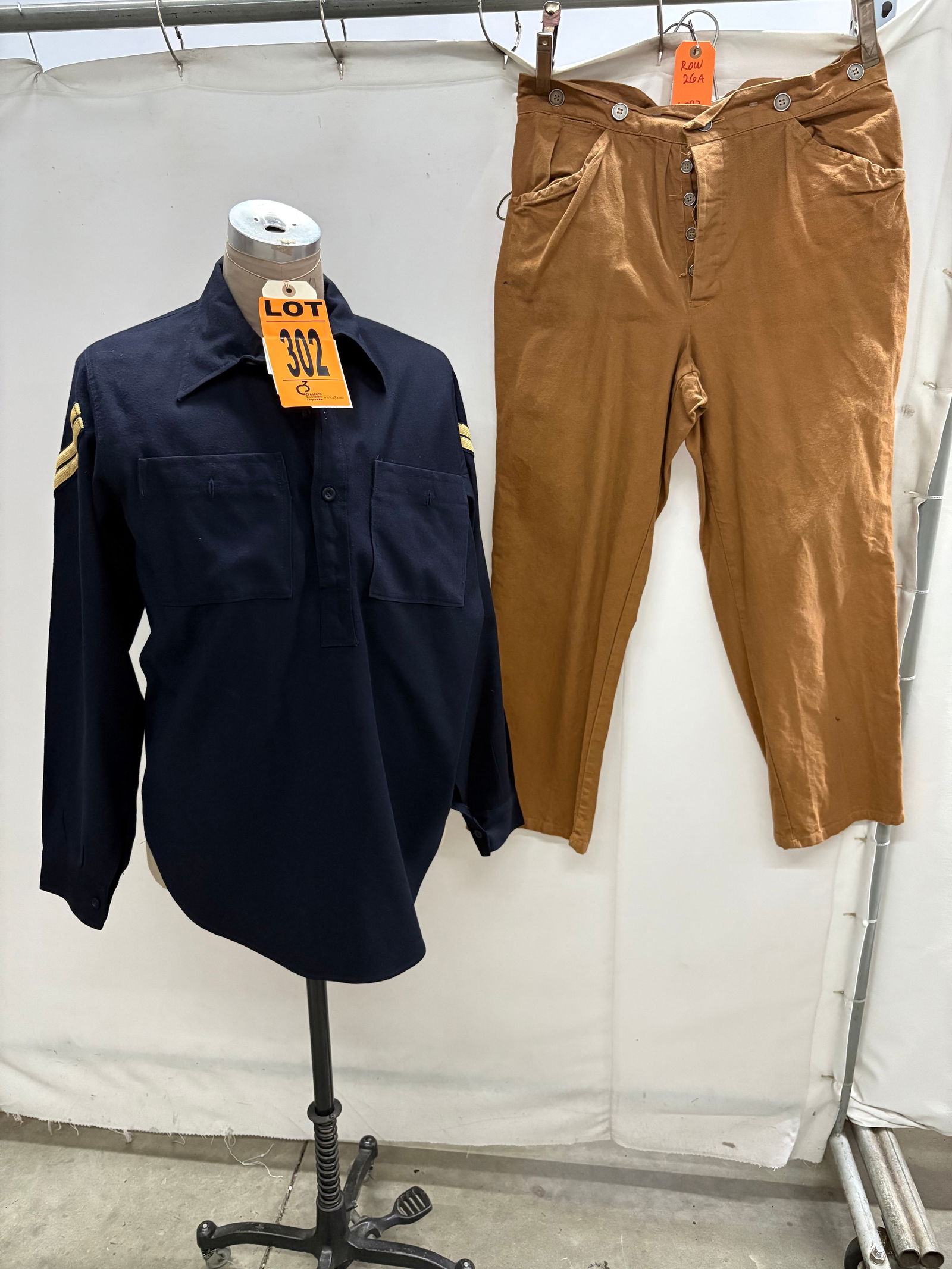 Corporal’s Uniform w/ CPL chevrons (2 pcs). featured in ROUGH RIDERS (1997) Location: Row 26A, (1 of 12)