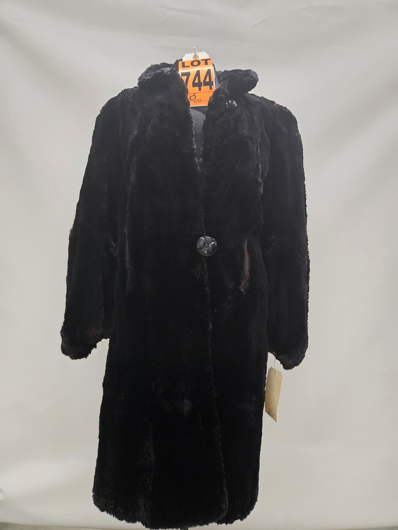 1920s black seal fur coat with deco buttons, some damage: 1920s black seal fur coat with deco buttons, some damage IMPORTANT NOTE TO BIDDERS: We are not an auction gallery but a liquidator retained by CRC as they wind-down operations. As such, we cannot offe