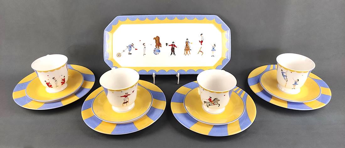 Hermes tableware set "Circus" for 4 persons, 1980/90, consisting of four la: Hermes tableware set "Circus" for 4 persons, 1980/90, consisting of four large plates, 4 cups with saucers as well as an oblong serving plate, porcelain in white with light blue and yellow colours as