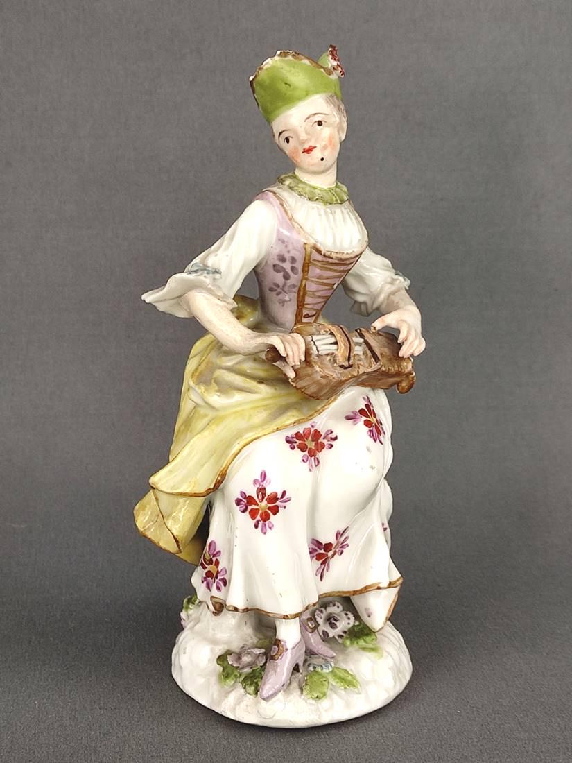 Lute player, polychrome painted, on naturalistic base, probably Meissen, pr: Lute player, polychrome painted, on naturalistic base, probably Meissen, probably 18th century, faint sword-base mark, height 12.5cm, damage to hat, foliage, some smaller chips Lautenspielerin, polych