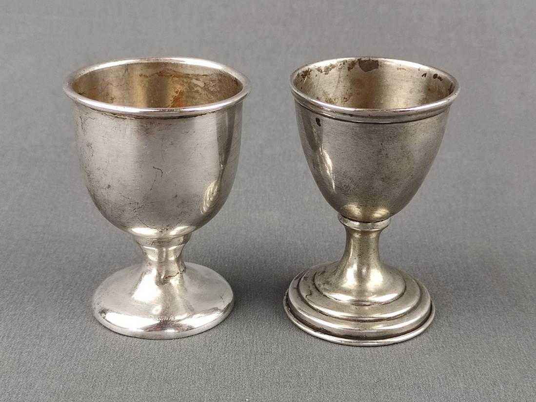 Two egg cups, silver 835 and silver 800, total weight 65g, one hallmarked on the top rim, height of: Two egg cups, silver 835 and silver 800, total weight 65g, one hallmarked on the top rim, height of both approx. 6.5cm, 4cm and 4.5cm in diameter Zwei Eierbecher, Silber 835 und Silber 800, Gesamtgewi