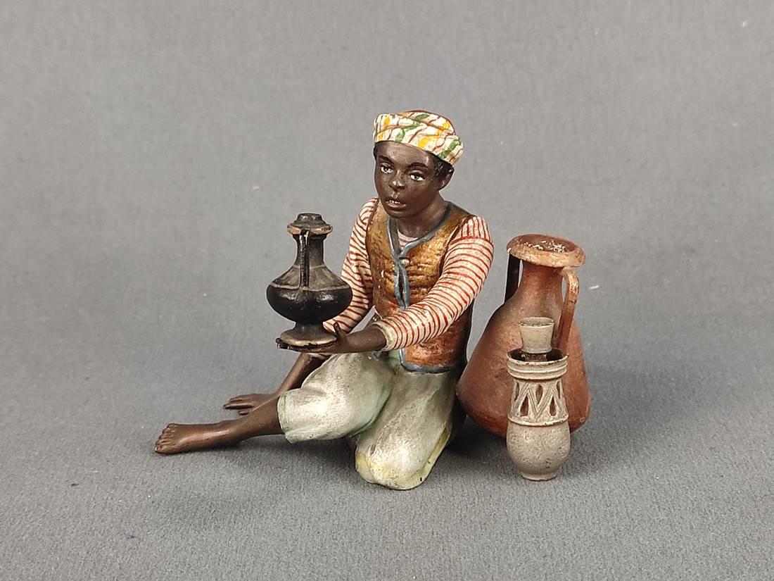 Bergmann, Franz Xaver (1861 - 1939 Austria) "Sitting Boy", one arm outstretched and holding a (1 of 4)