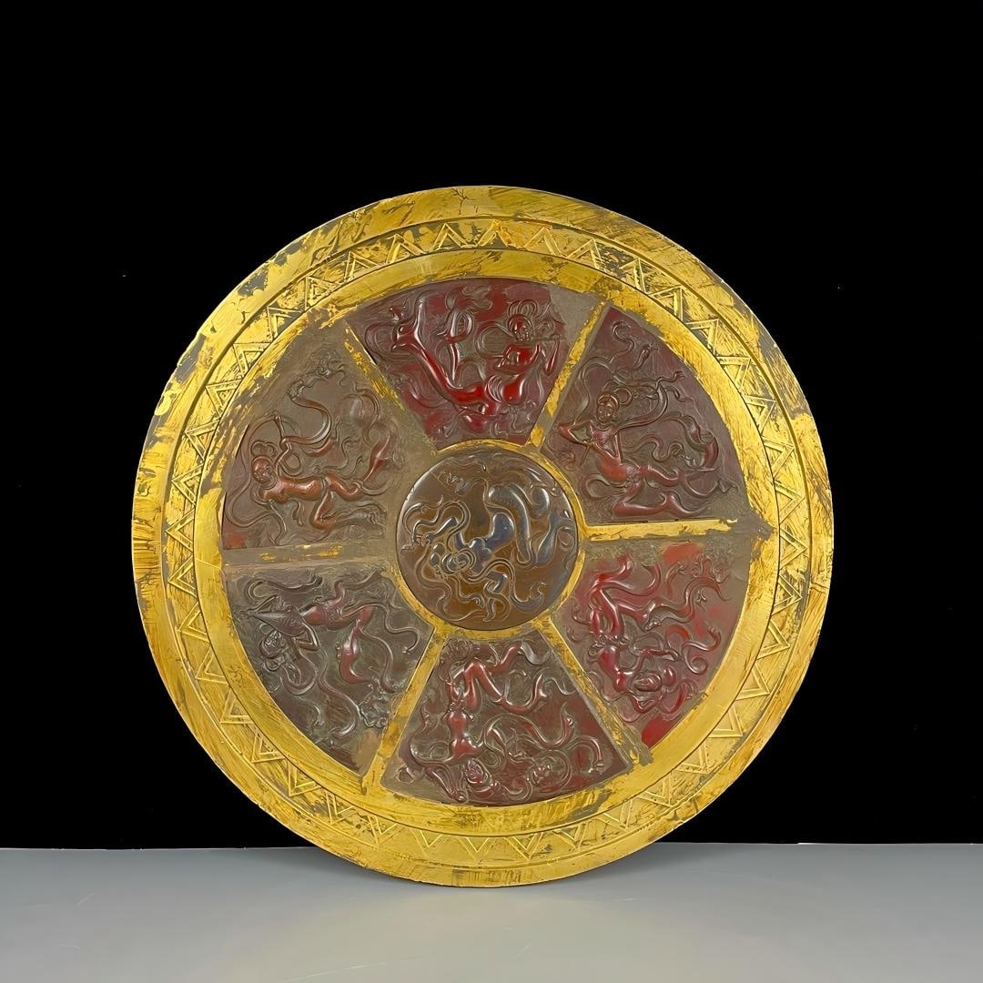 Hetian gilded mirror inlaid with red jade: Ancient Hetian gilt-bronze inlaid red jade mirror. Dimensions: 32 x 2 cm, Weight: 4155 g Provenance:Private collection from a professor in Yale University. Our dedicated team expertly handles both dom